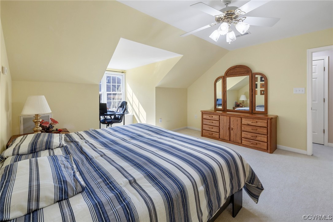 5000 Park Commons Loop Glen Allen, VA 23059 - Photo 27 of 32 a bedroom with a bed and a chandelier
