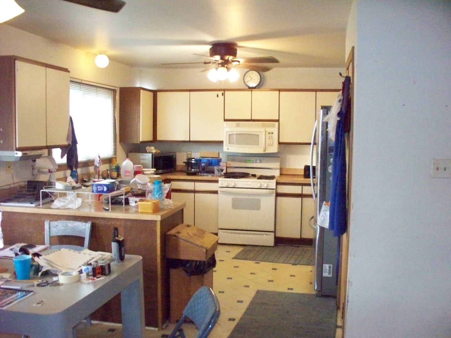 513 Appleton Drive Batavia, IL 60510 - Photo 9 of 31 a kitchen with sink cabinets and window