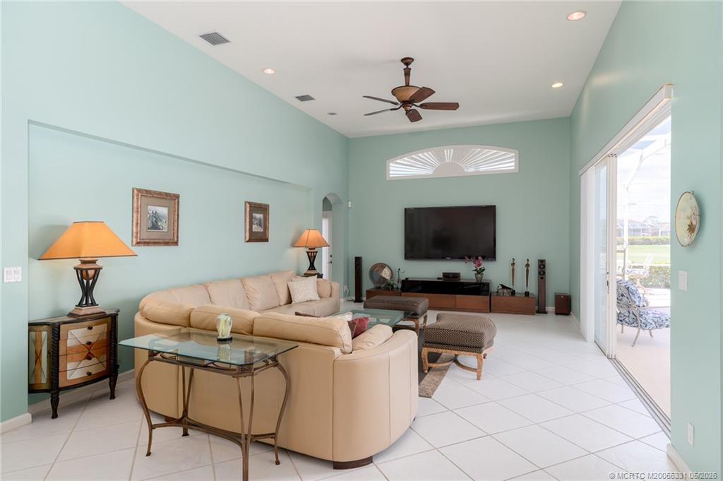 2216 Southeast Stonehaven Road Port St. Lucie, FL 34952 - Photo 16 of 67 a living room with furniture and a flat screen tv