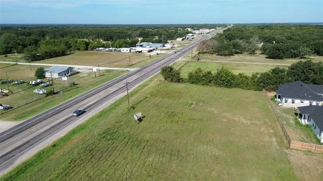 a view of a pool with a yard