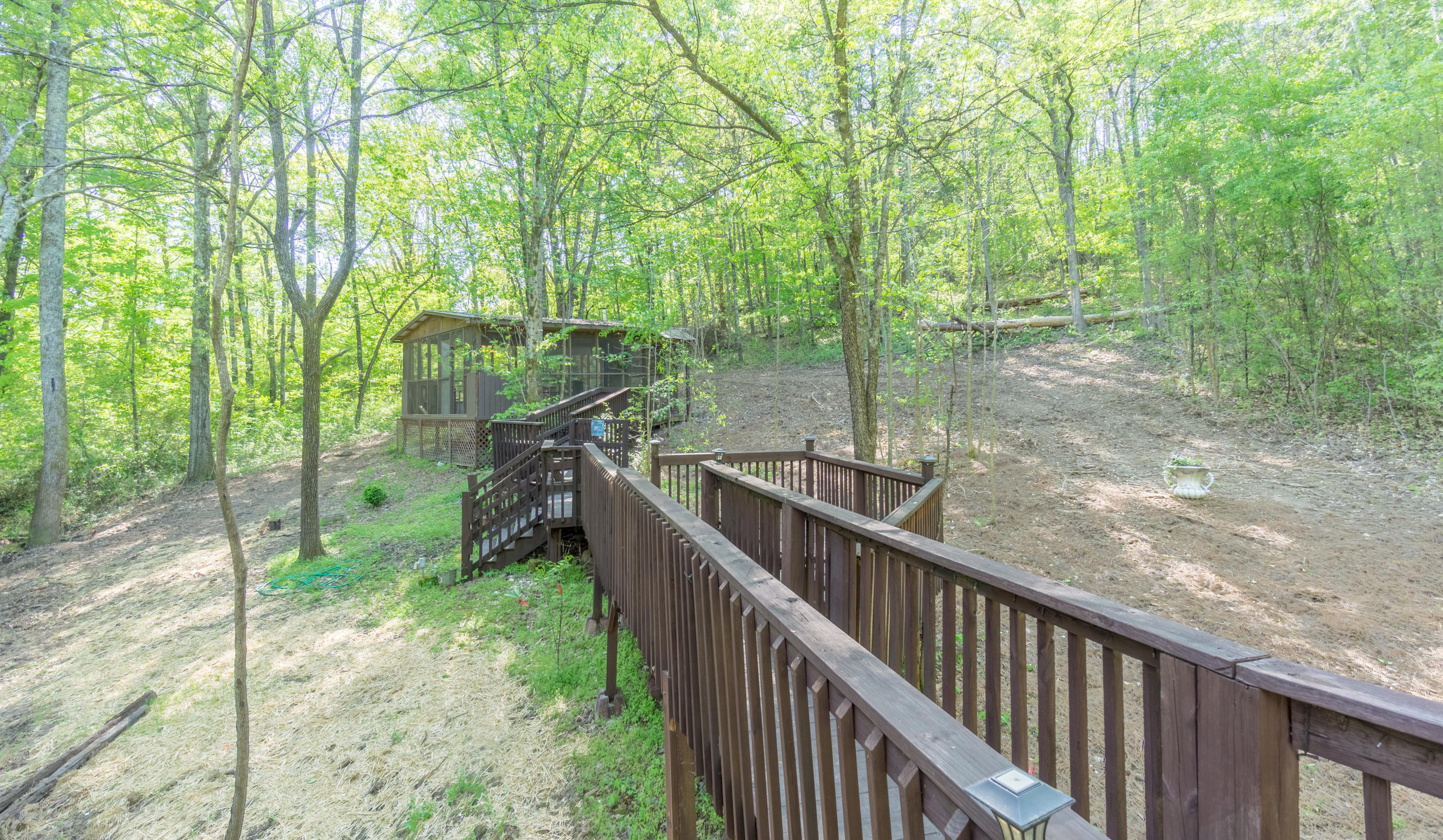 6661 Sandswitch Road Hixson, TN 37343 - Photo 48 of 57 Deck walkway leading to screen cabin