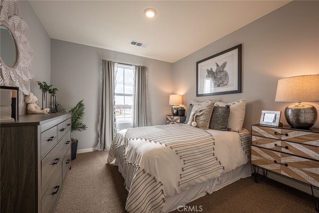 4735 Jema Way, Unit 9 B1 Merced, CA 95348 - Photo 15 of 19 a bedroom with a bed and a window