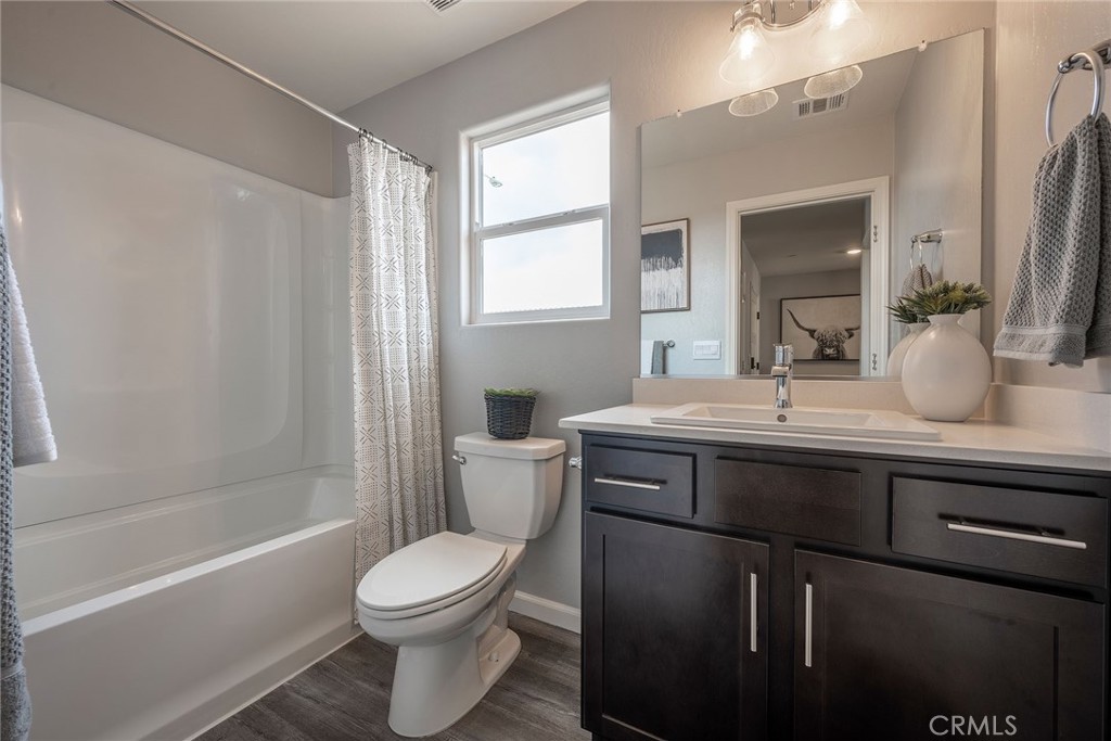 4735 Jema Way, Unit 9 B1 Merced, CA 95348 - Photo 16 of 19 a bathroom with a sink a toilet and shower