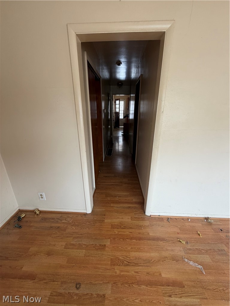 55060 National Road Bridgeport, OH 43912 - Photo 3 of 14 Hallway with wood finished floors and baseboards
