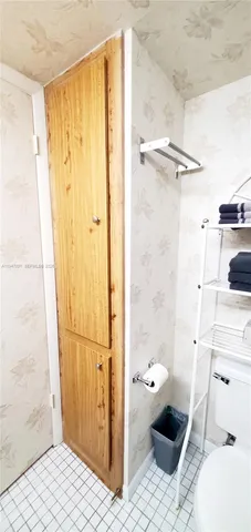 an empty room with windows and painted walls