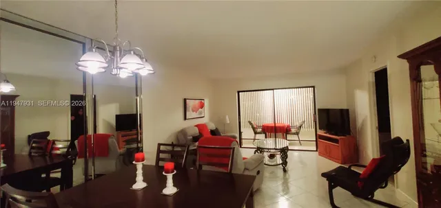 a kitchen with granite countertop a stove a sink and a microwave