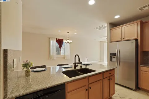 a kitchen with stainless steel appliances a stove and a refrigerator