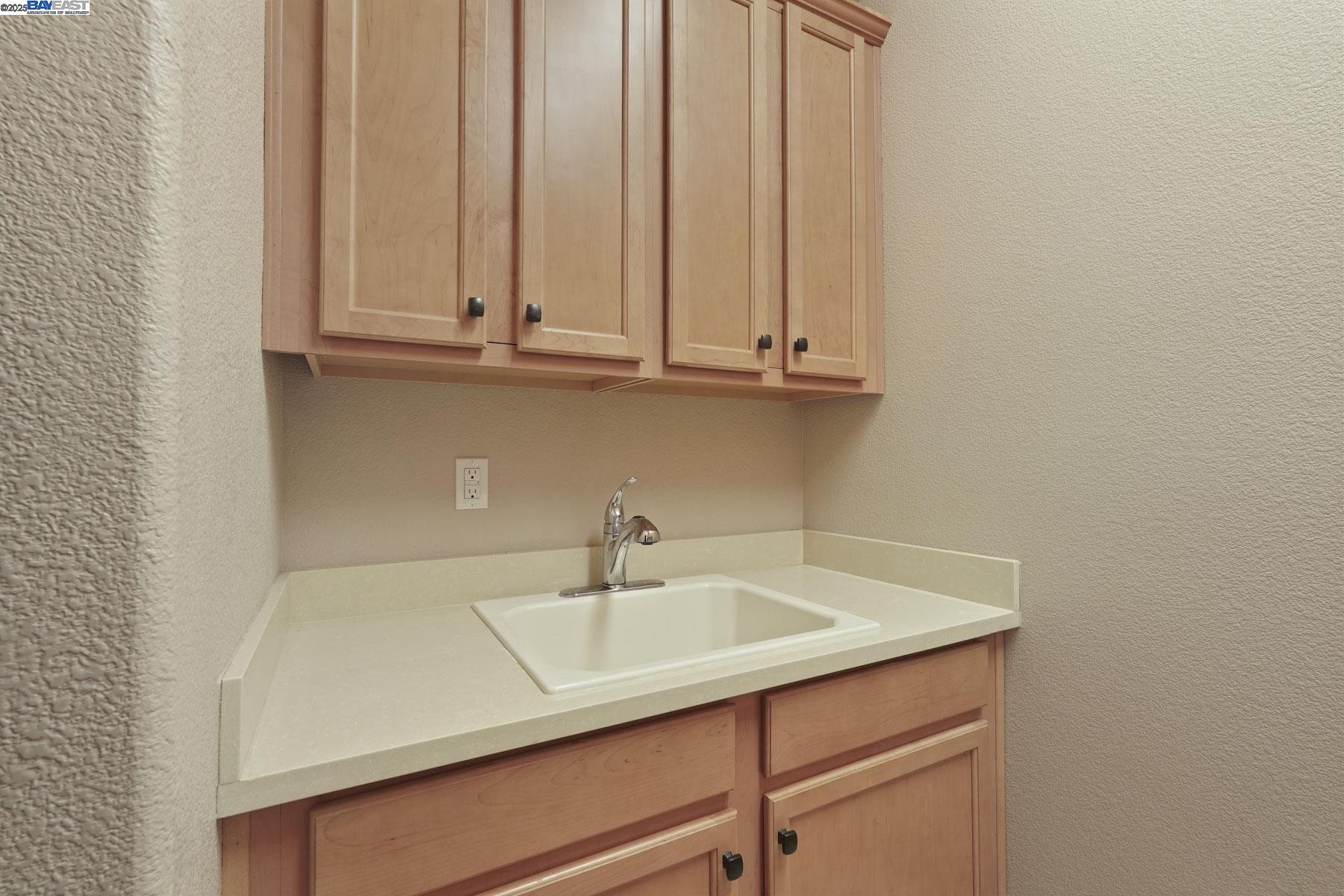 2961 Clear Pt Way Manteca, CA 95336 - Photo 16 of 54 a bathroom with a sink and cabinets