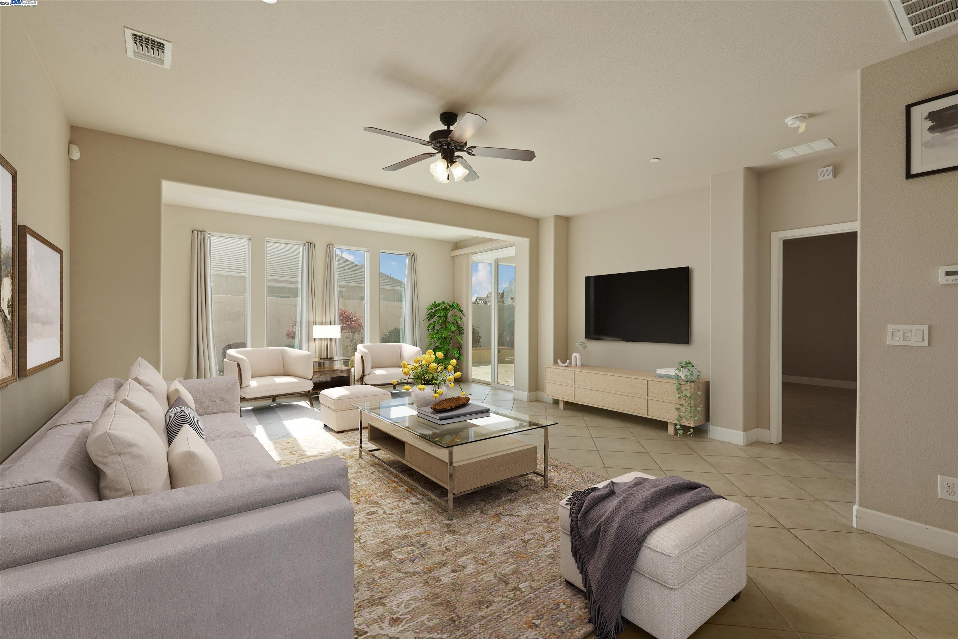 2961 Clear Pt Way Manteca, CA 95336 - Photo 19 of 54 a living room with furniture ceiling fan and a flat screen tv