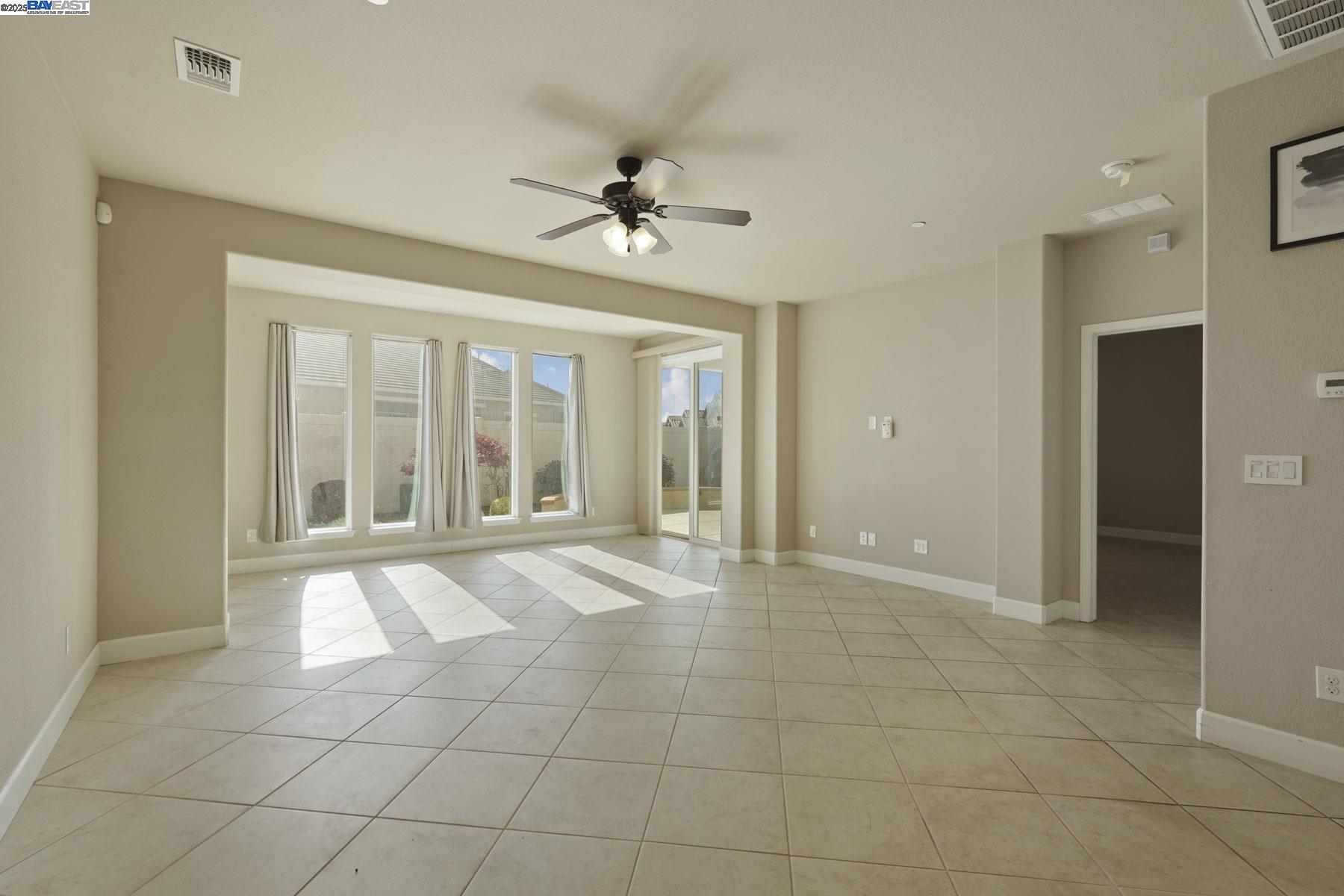 2961 Clear Pt Way Manteca, CA 95336 - Photo 20 of 54 a view of an empty room with a window