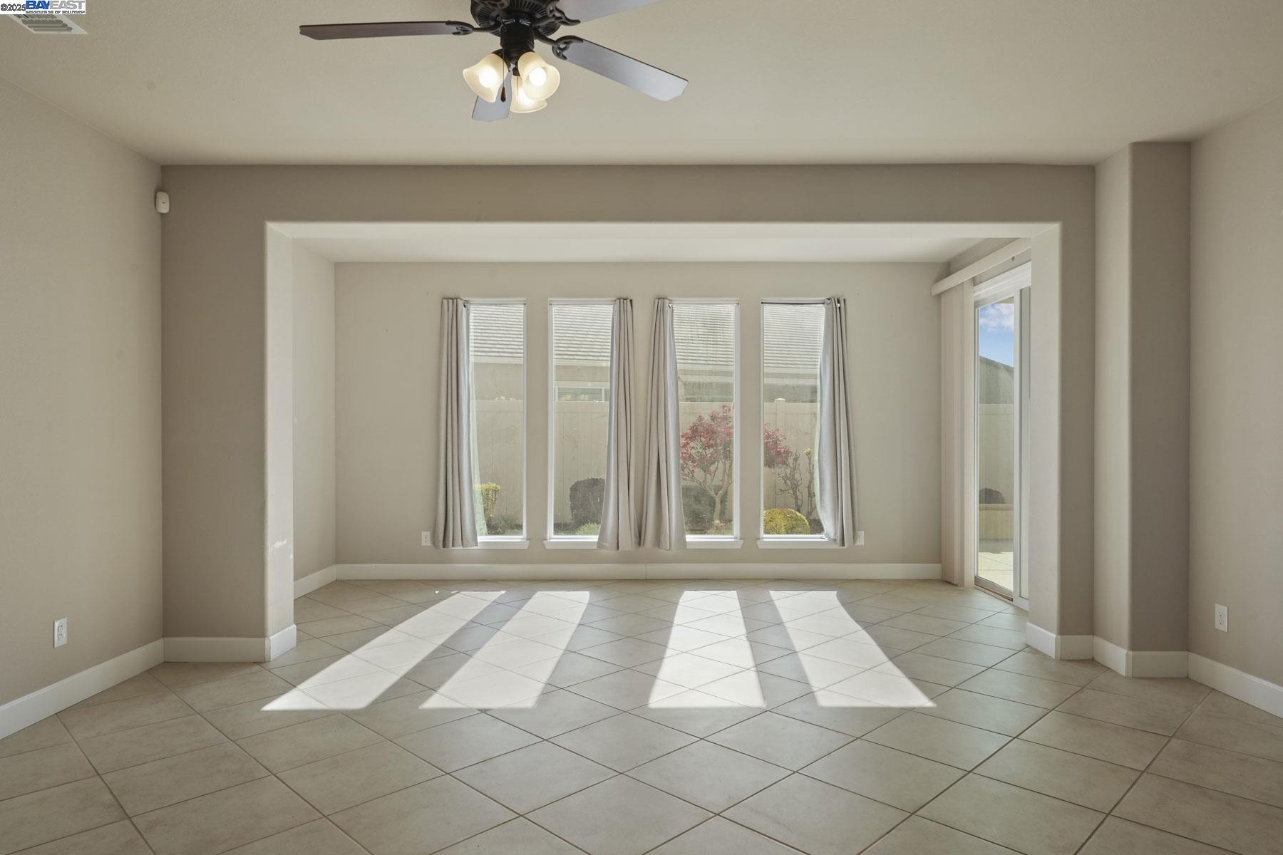 2961 Clear Pt Way Manteca, CA 95336 - Photo 21 of 54 wooden floor in an empty room with a window