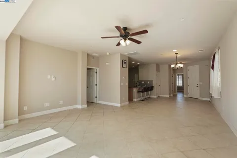 a view of a room with a large window and front door