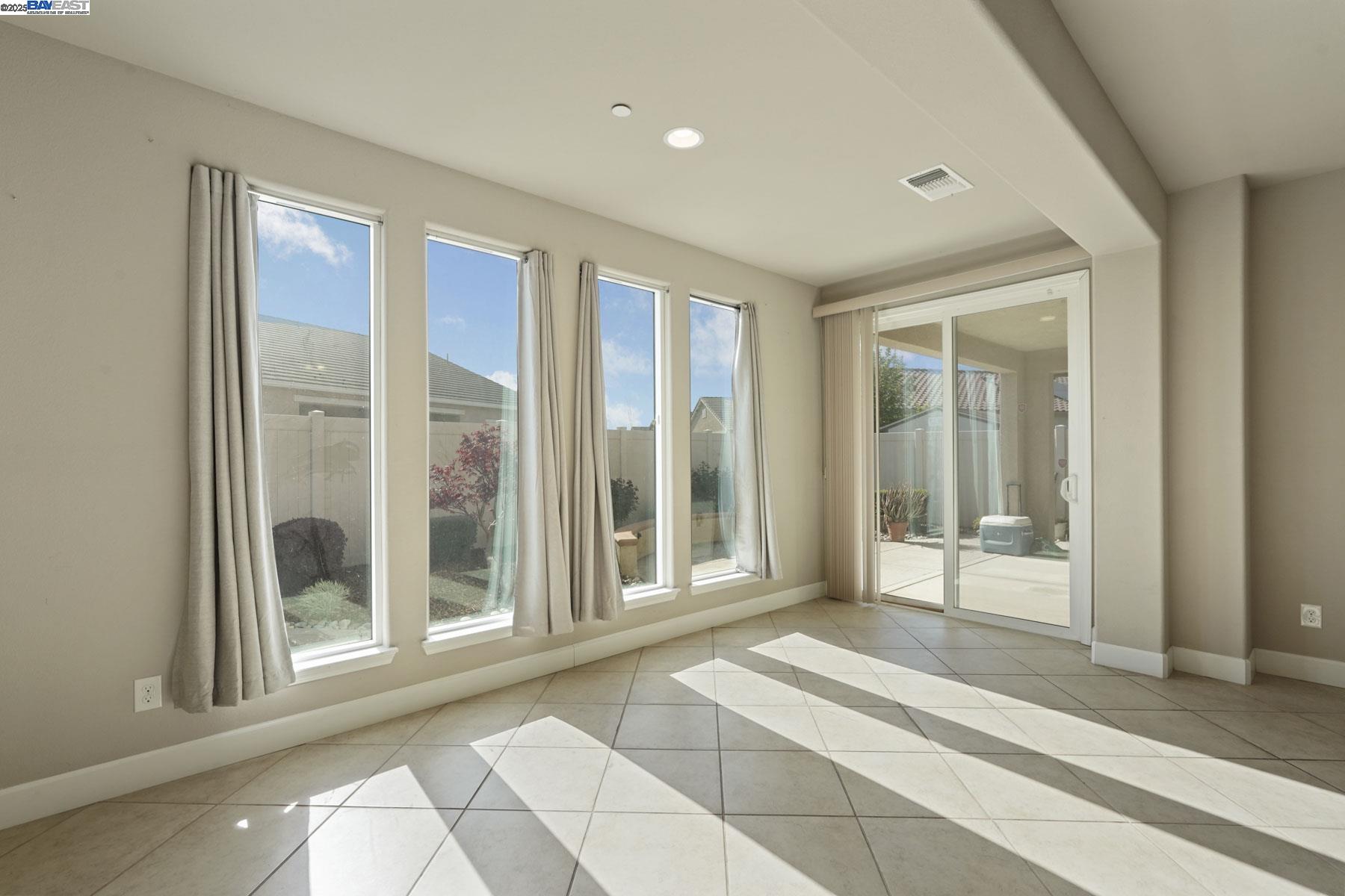 2961 Clear Pt Way Manteca, CA 95336 - Photo 25 of 54 a view of a room with a large window and front door