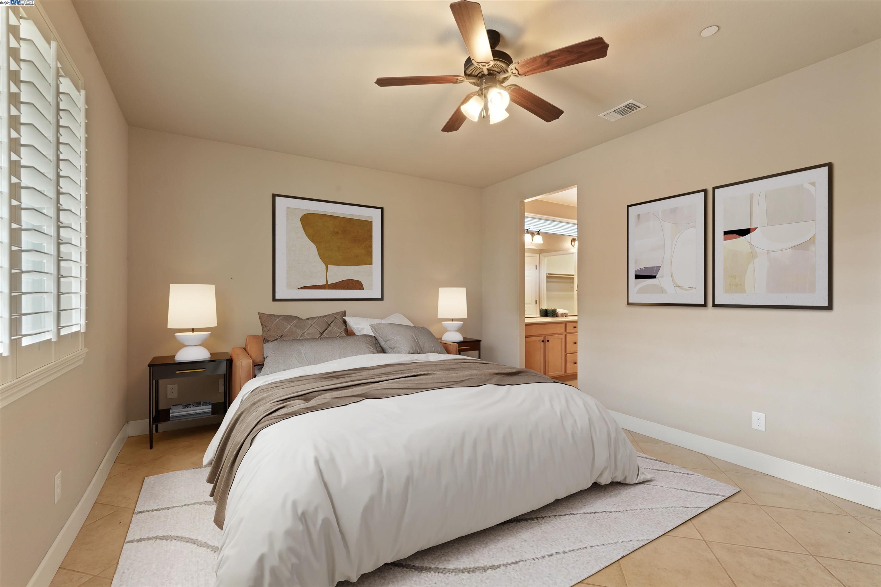 2961 Clear Pt Way Manteca, CA 95336 - Photo 26 of 54 a bedroom with a large bed and a chandelier