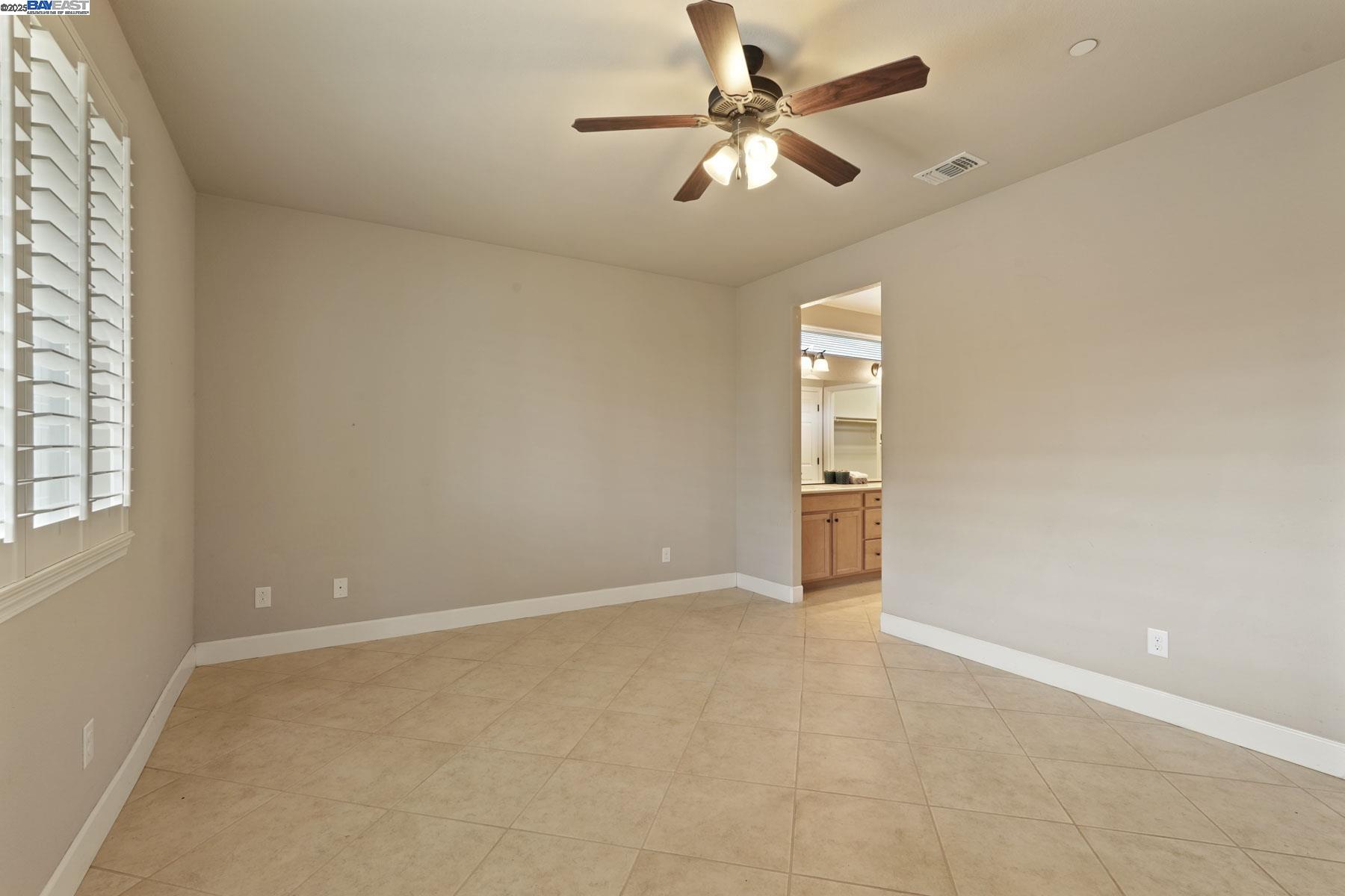 2961 Clear Pt Way Manteca, CA 95336 - Photo 28 of 54 wooden floor in an empty room with a window