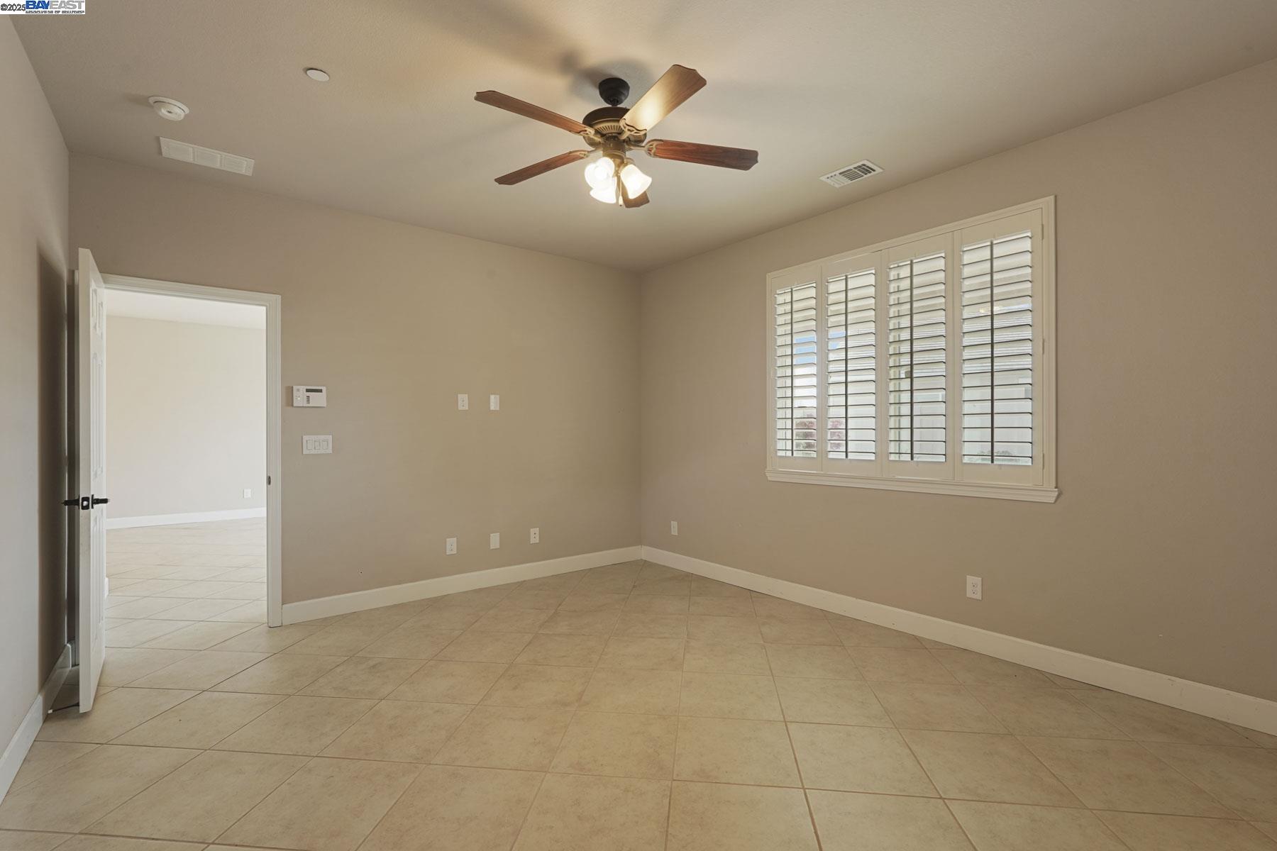 2961 Clear Pt Way Manteca, CA 95336 - Photo 29 of 54 a view of an empty room with a window
