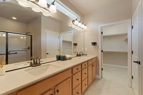 a bathroom with a glass shower door
