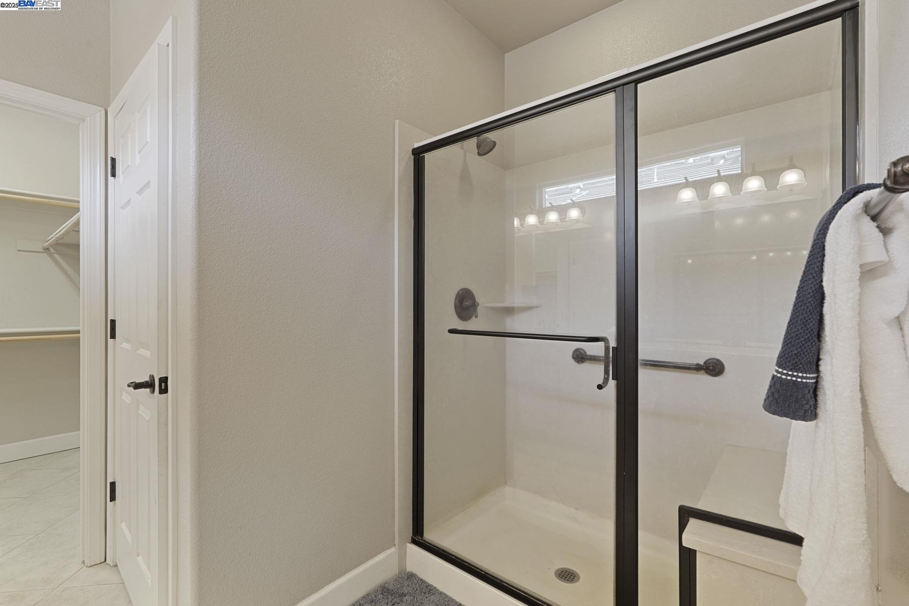 2961 Clear Pt Way Manteca, CA 95336 - Photo 31 of 54 a bathroom with a glass shower door