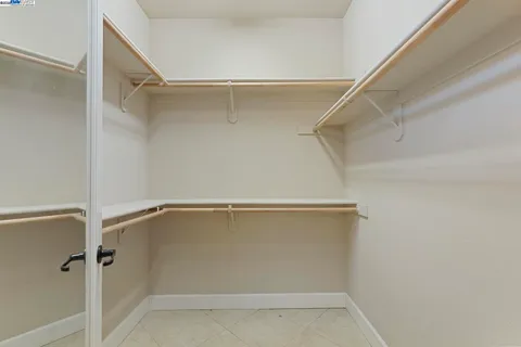 a bathroom with a sink vanity mirror and toilet