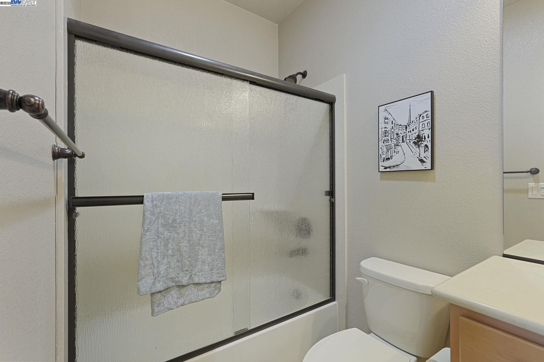 2961 Clear Pt Way Manteca, CA 95336 - Photo 34 of 54 a bathroom with a shower and toilet