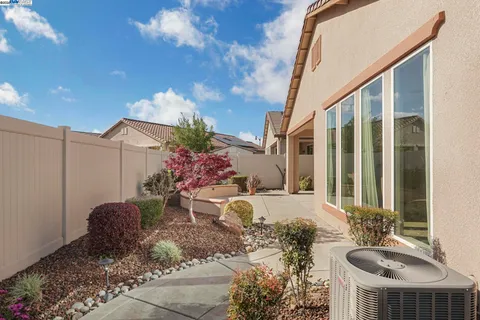 a very nice looking bedroom with a large window