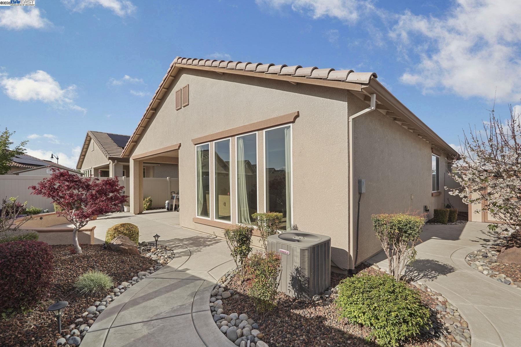 2961 Clear Pt Way Manteca, CA 95336 - Photo 45 of 54 a front view of a house with a yard