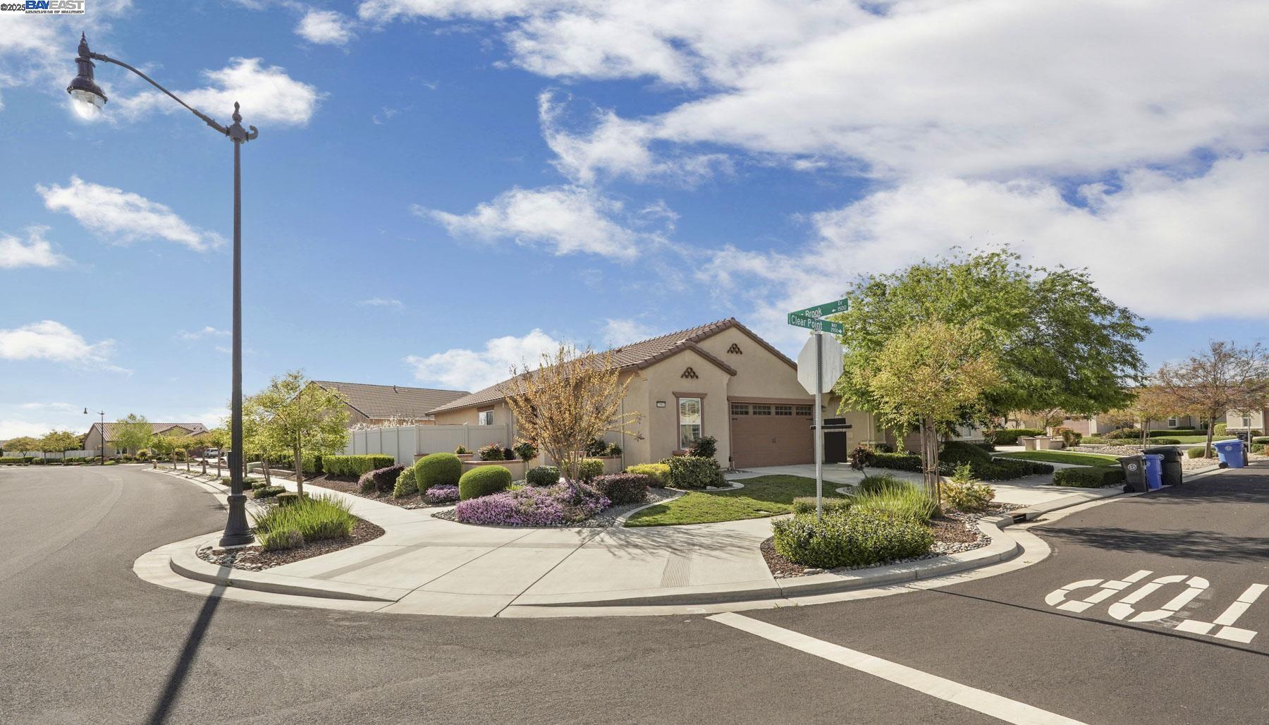 2961 Clear Pt Way Manteca, CA 95336 - Photo 5 of 54 a view of a street with a house