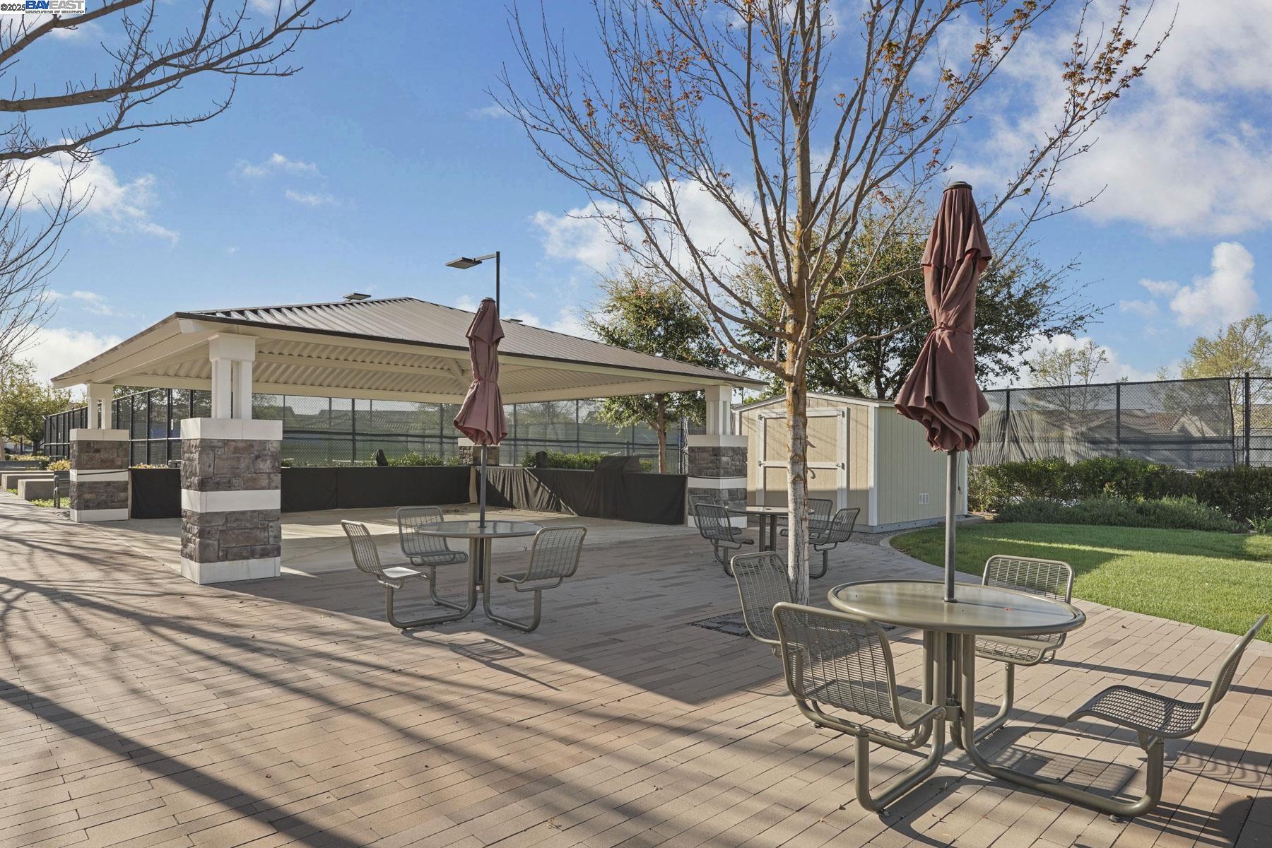 2961 Clear Pt Way Manteca, CA 95336 - Photo 52 of 54 a view of a chair and tables in the patio of the house