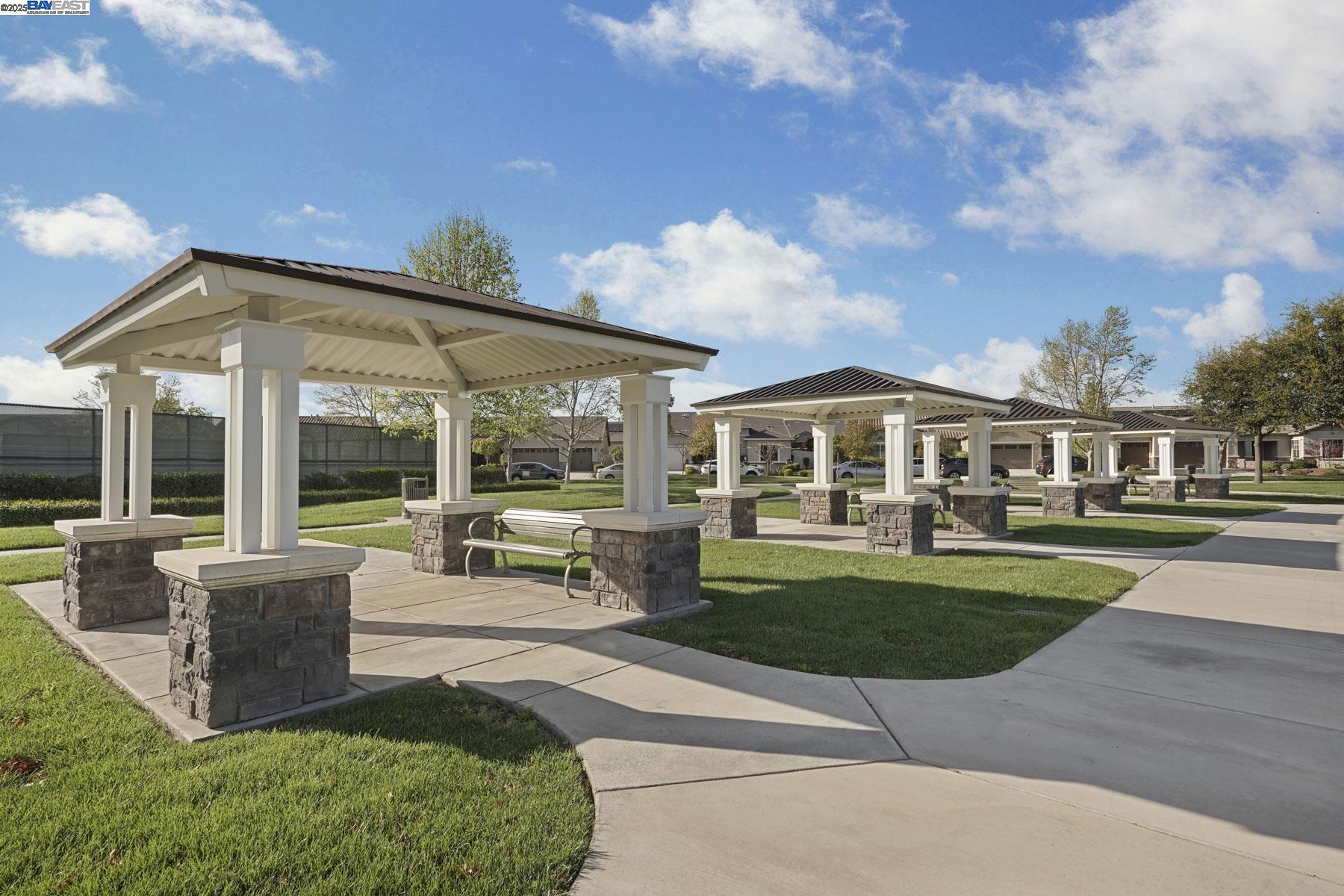 2961 Clear Pt Way Manteca, CA 95336 - Photo 53 of 54 a view of a house with backyard sitting area and garden