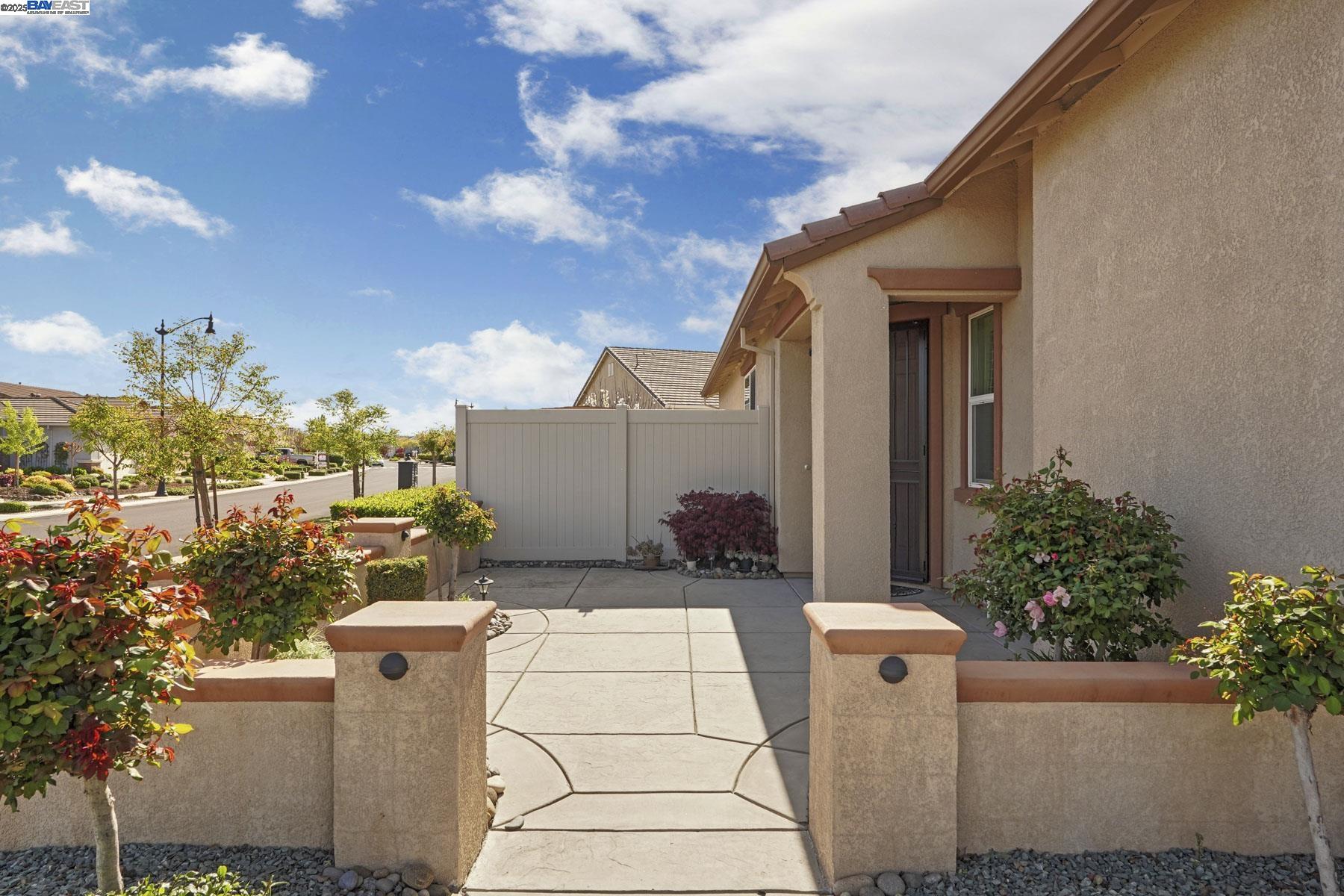 2961 Clear Pt Way Manteca, CA 95336 - Photo 8 of 54 a front view of a house with a yard