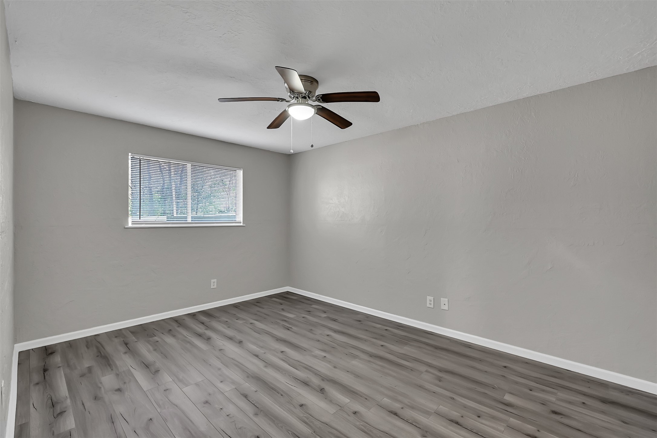29806 Lazy Lane Spring, TX 77386 - Photo 12 of 22 a view of empty room with wooden floor and fan