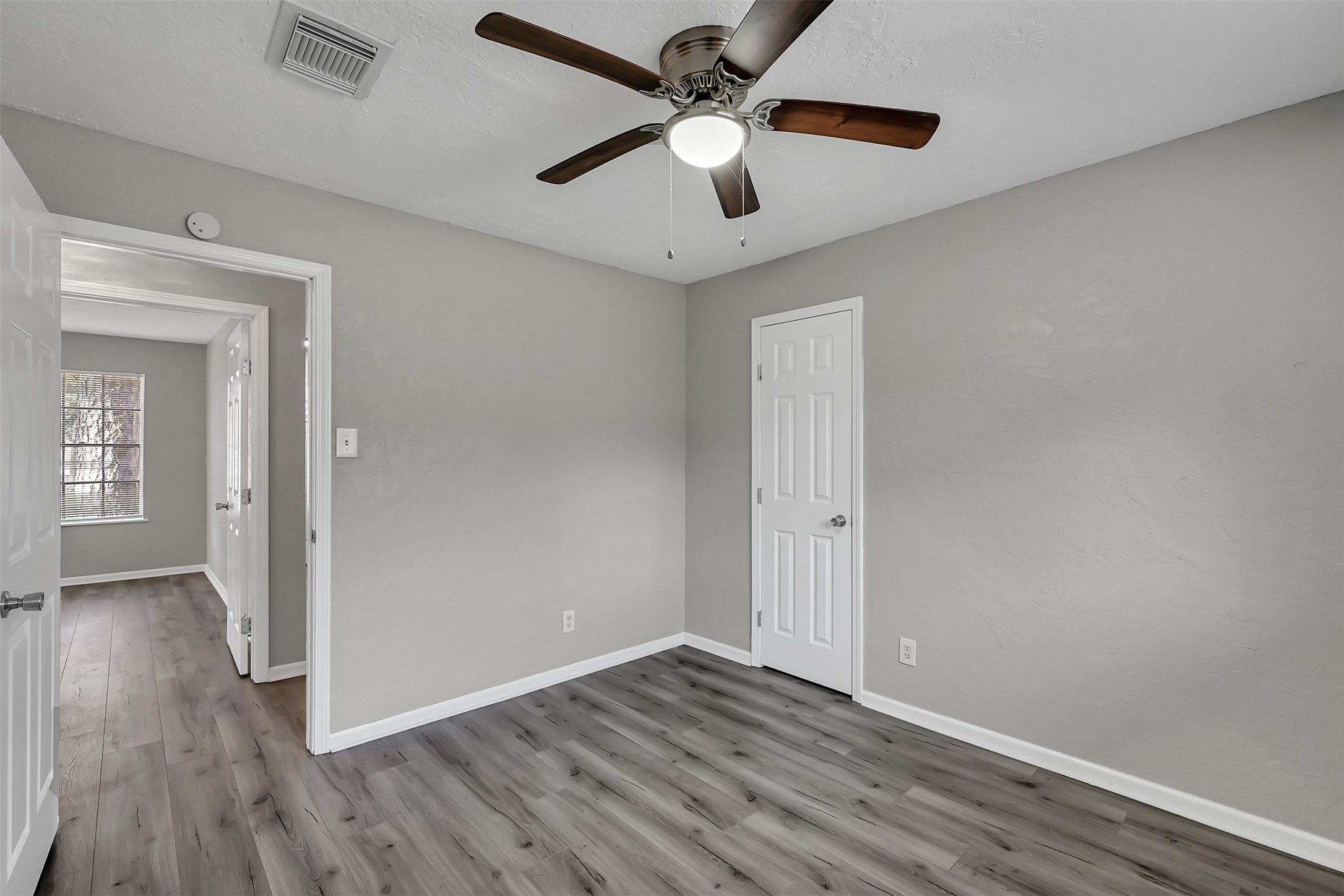 29806 Lazy Lane Spring, TX 77386 - Photo 16 of 22 wooden floor in an empty room with a window