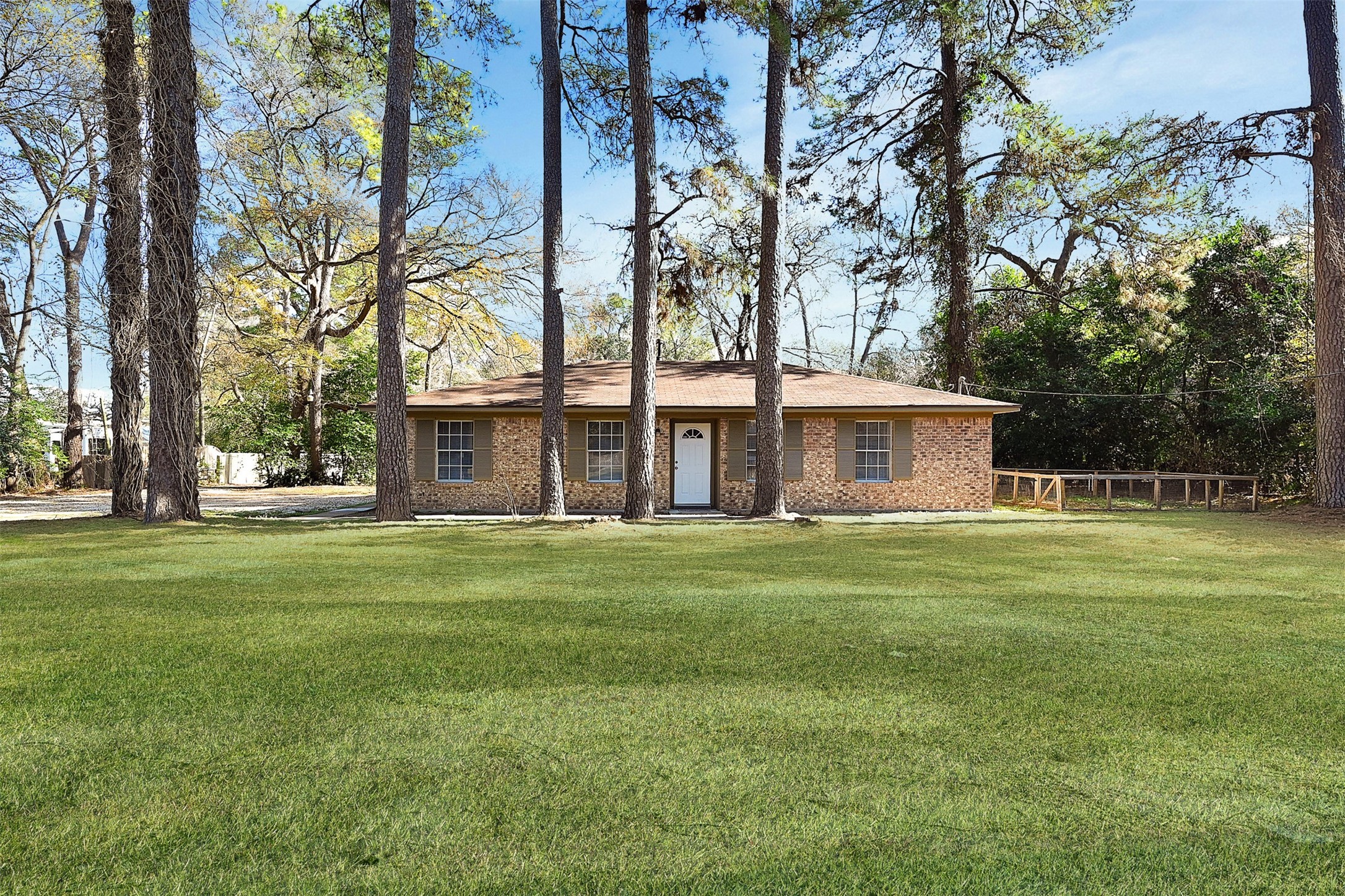 29806 Lazy Lane Spring, TX 77386 - Photo 17 of 22 a front view of a house with a garden
