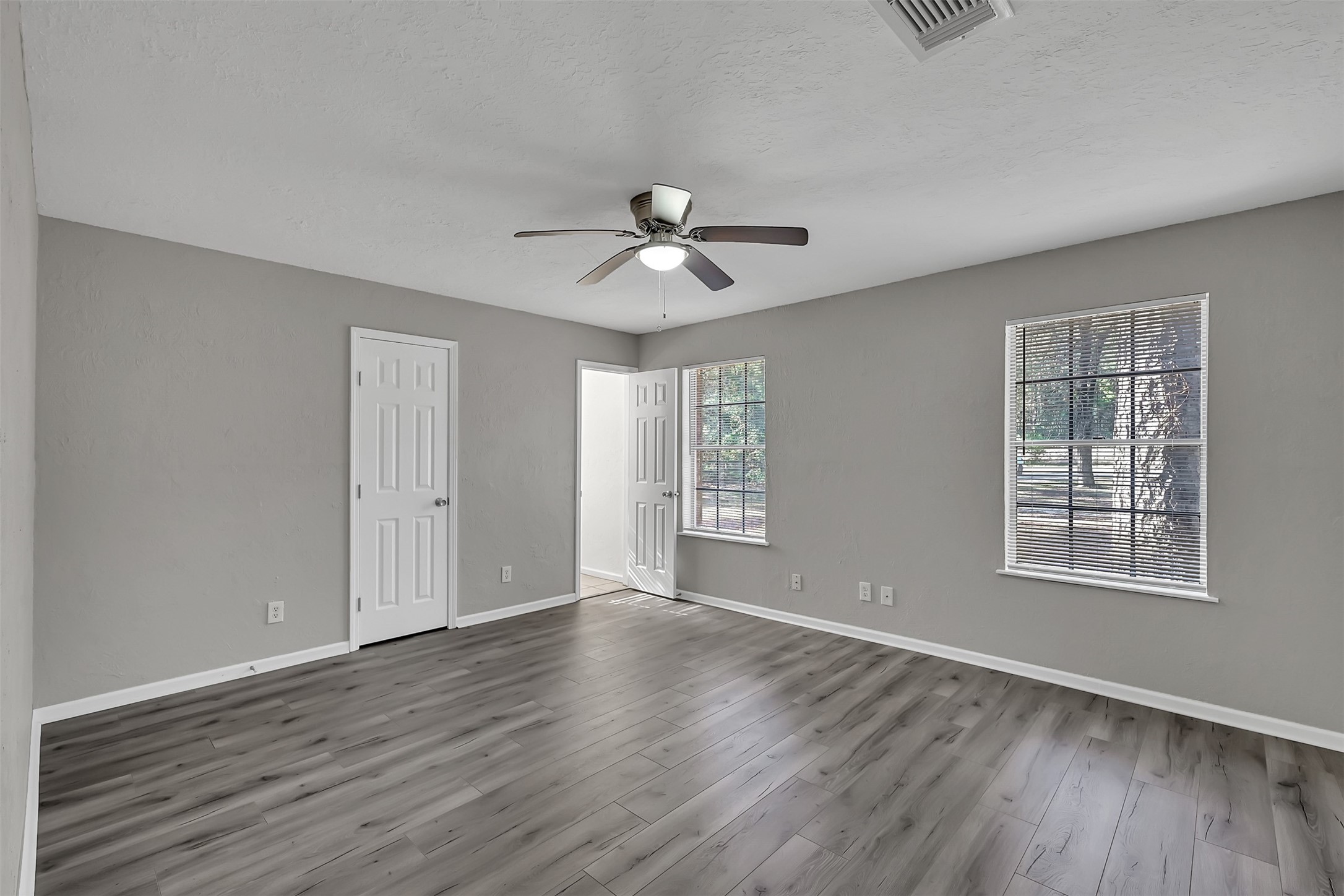 29806 Lazy Lane Spring, TX 77386 - Photo 9 of 22 wooden floor in an empty room with a window