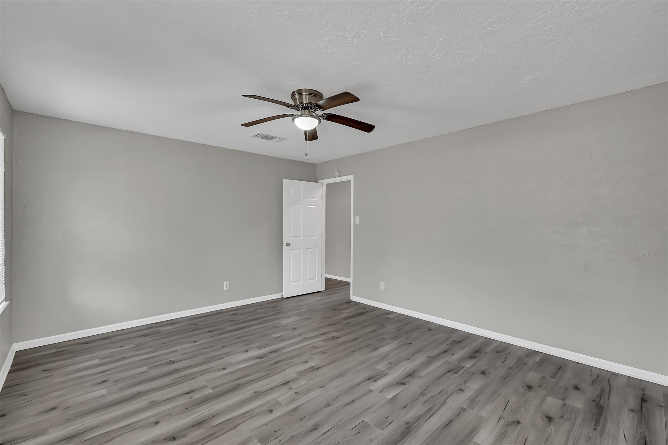29806 Lazy Lane Spring, TX 77386 - Photo 10 of 22 a view of room with wooden floor and ceiling fan
