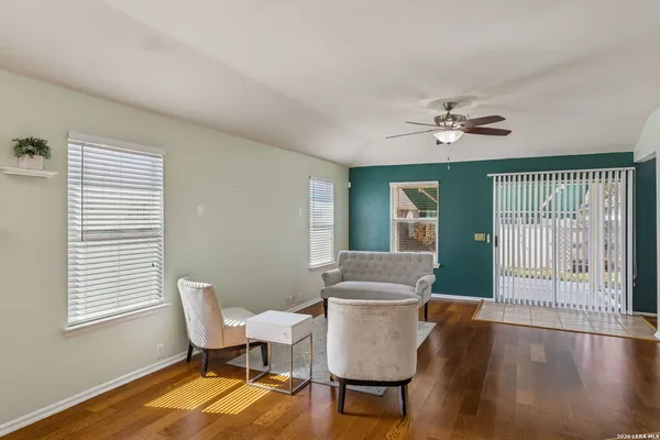 a view of a dining room with furniture window and wooden floor