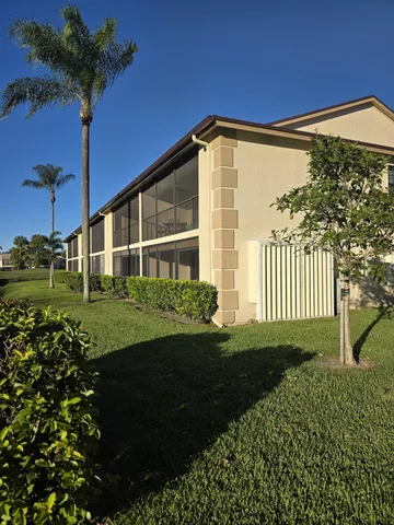 a view of a lake with a house in the background