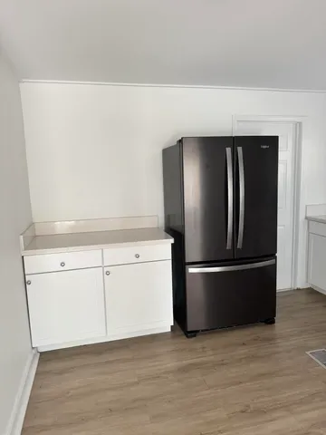 a view of kitchen with wooden floor