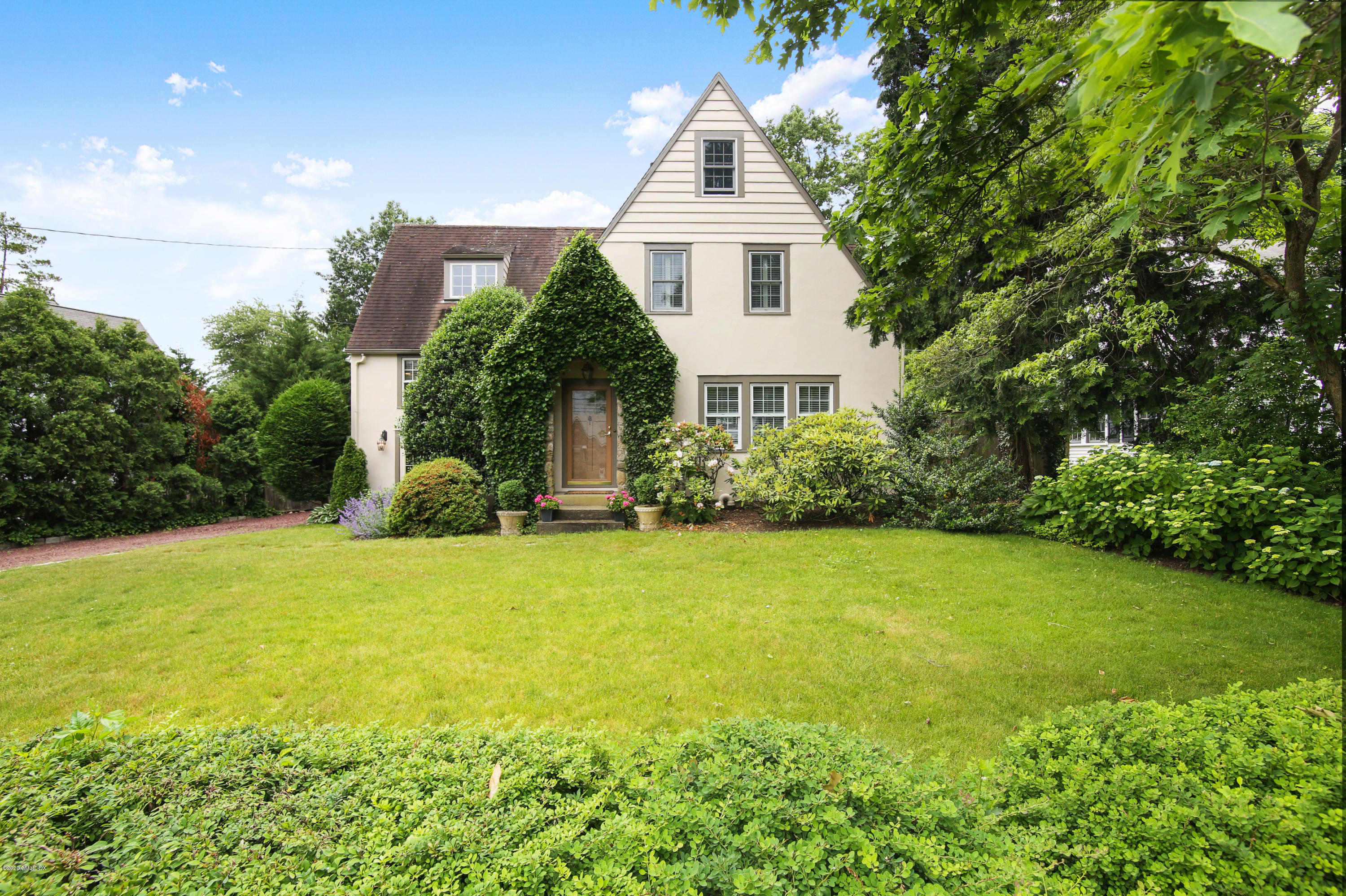 38 Oval Avenue Riverside, CT 06878 - Photo 1 of 33 a view of a house with backyard and garden