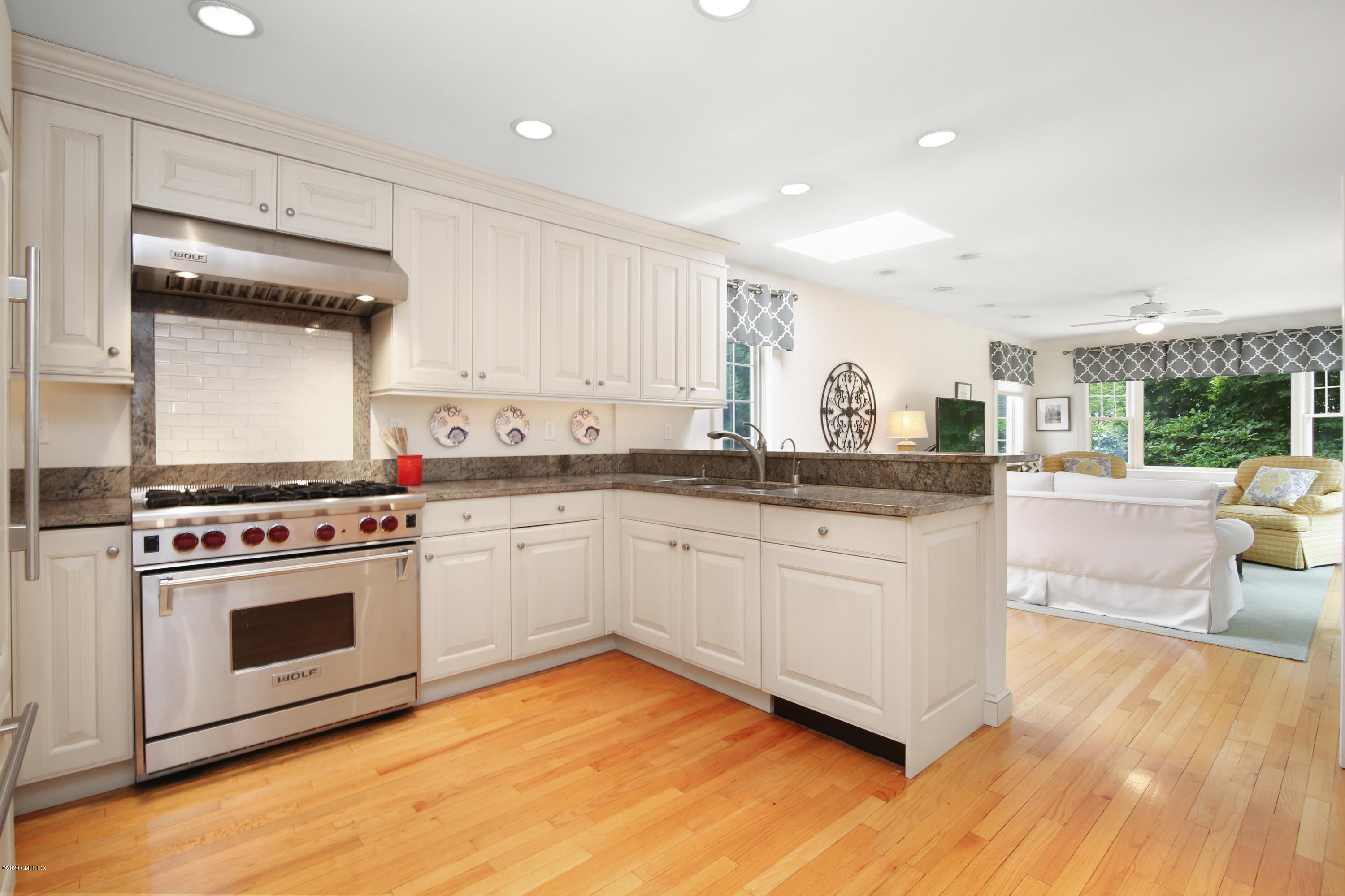 38 Oval Avenue Riverside, CT 06878 - Photo 12 of 33 a kitchen with a stove a sink and a refrigerator