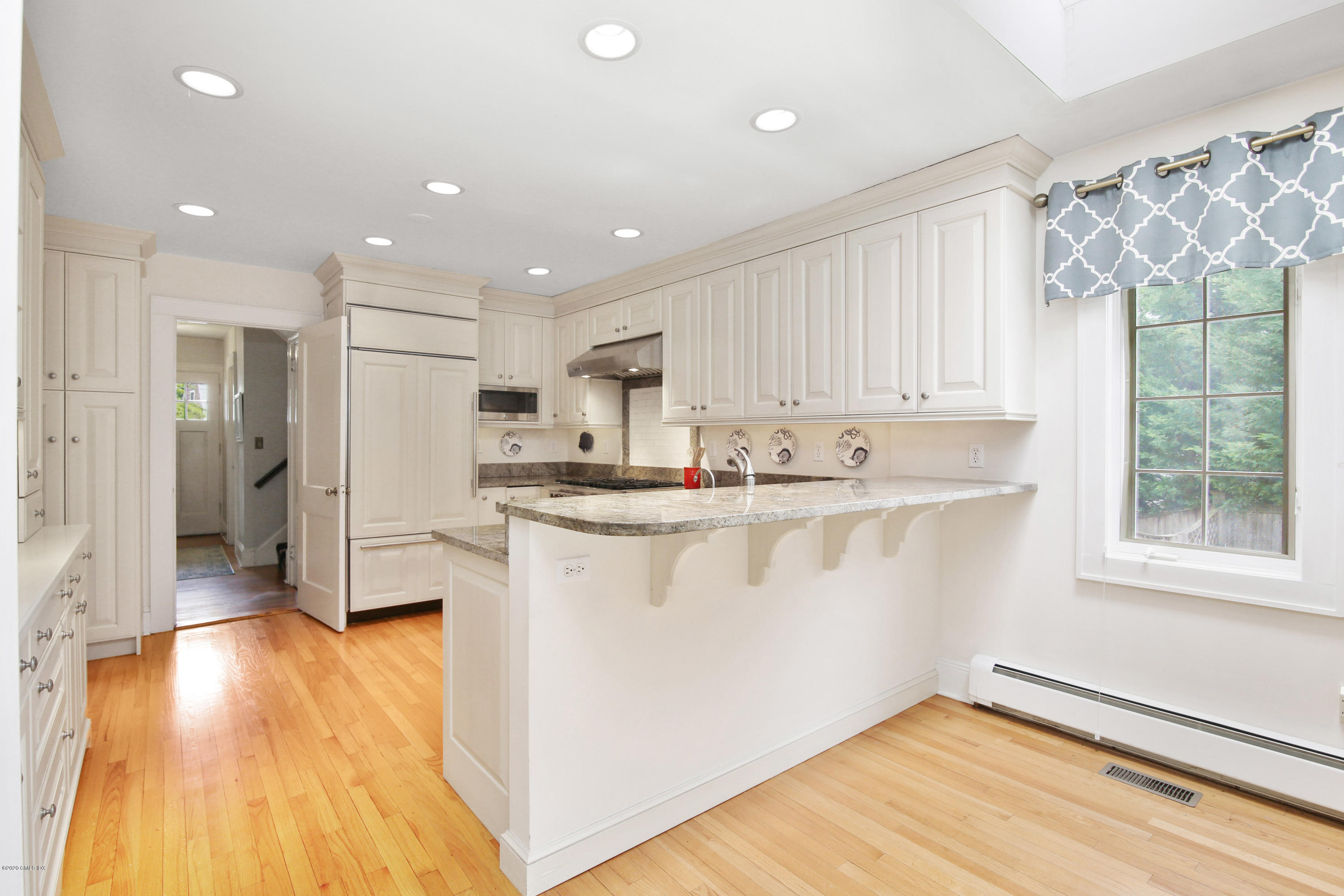 38 Oval Avenue Riverside, CT 06878 - Photo 13 of 33 a kitchen with stainless steel appliances granite countertop a refrigerator a sink and a stove