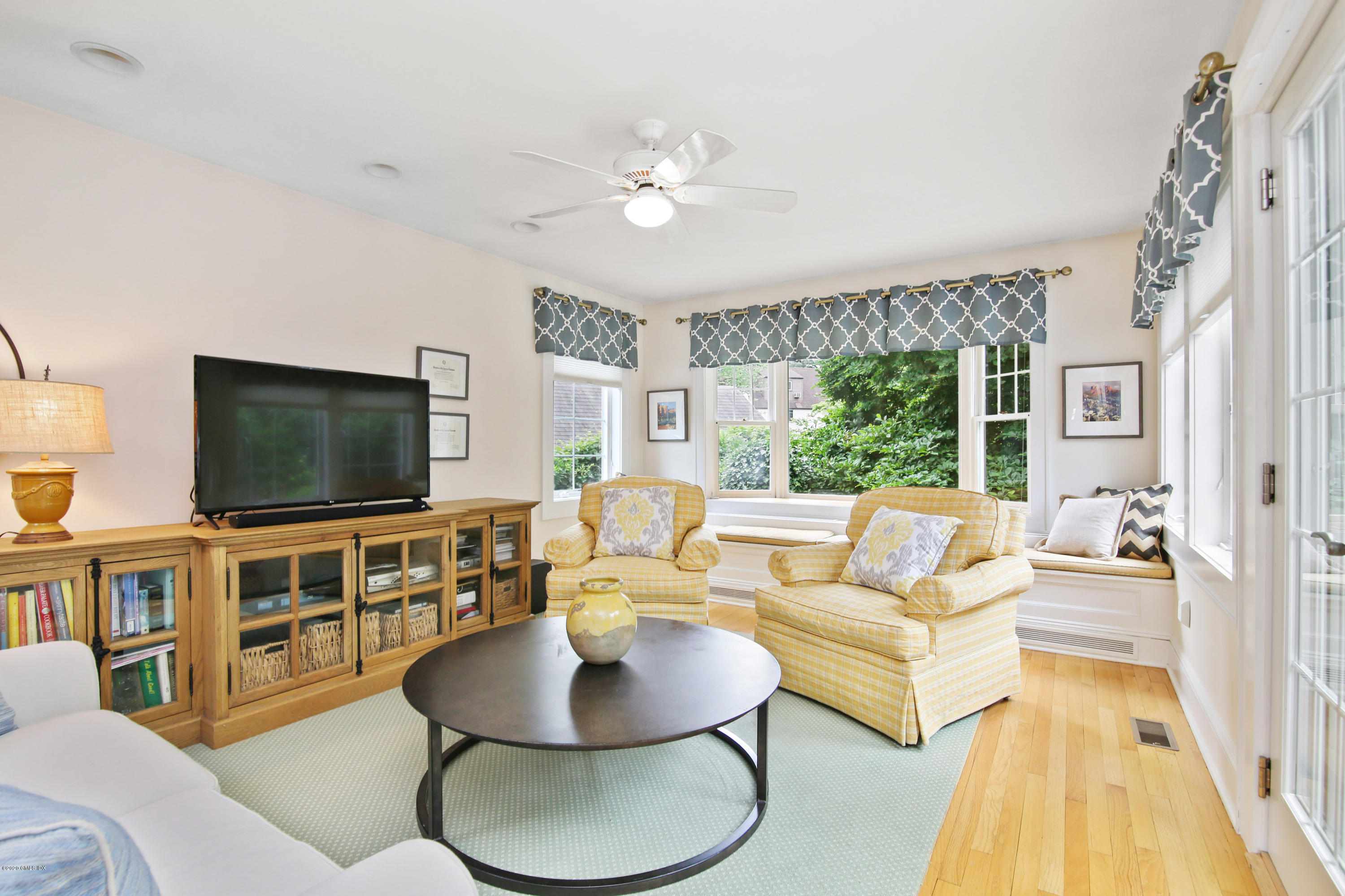 38 Oval Avenue Riverside, CT 06878 - Photo 16 of 33 a living room with furniture and a flat screen tv