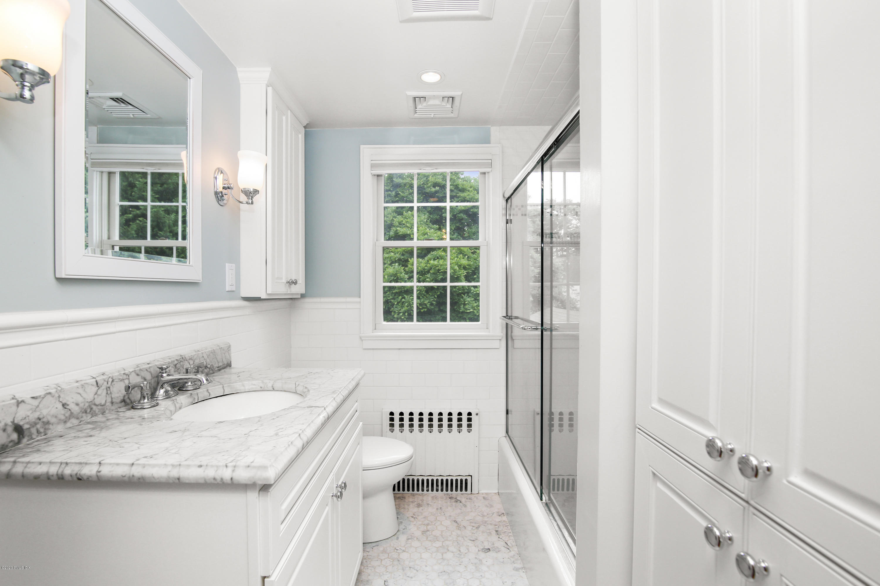 38 Oval Avenue Riverside, CT 06878 - Photo 20 of 33 a bathroom with a granite countertop sink and a window