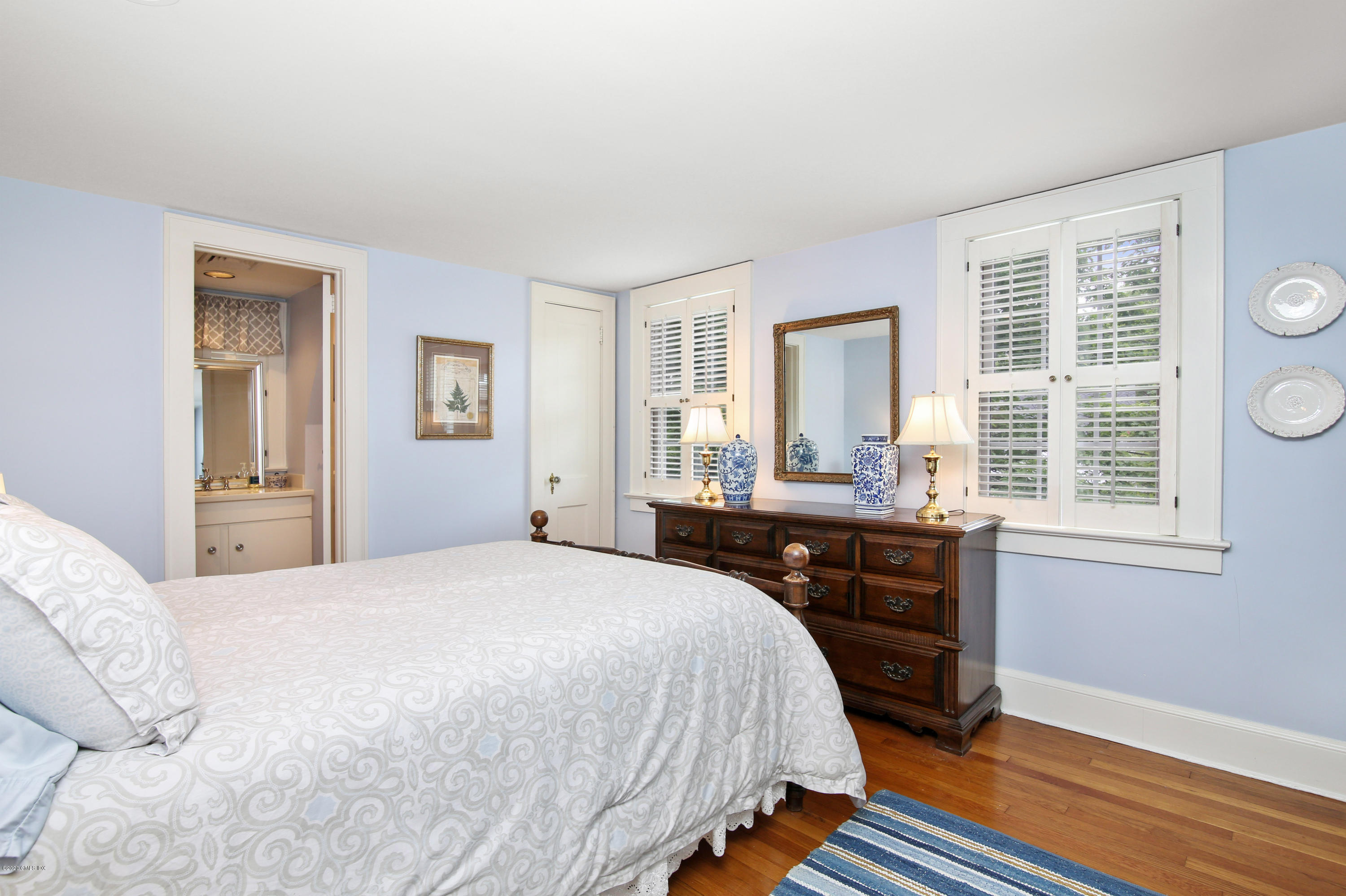 38 Oval Avenue Riverside, CT 06878 - Photo 25 of 33 a bedroom with a bed and wooden floor