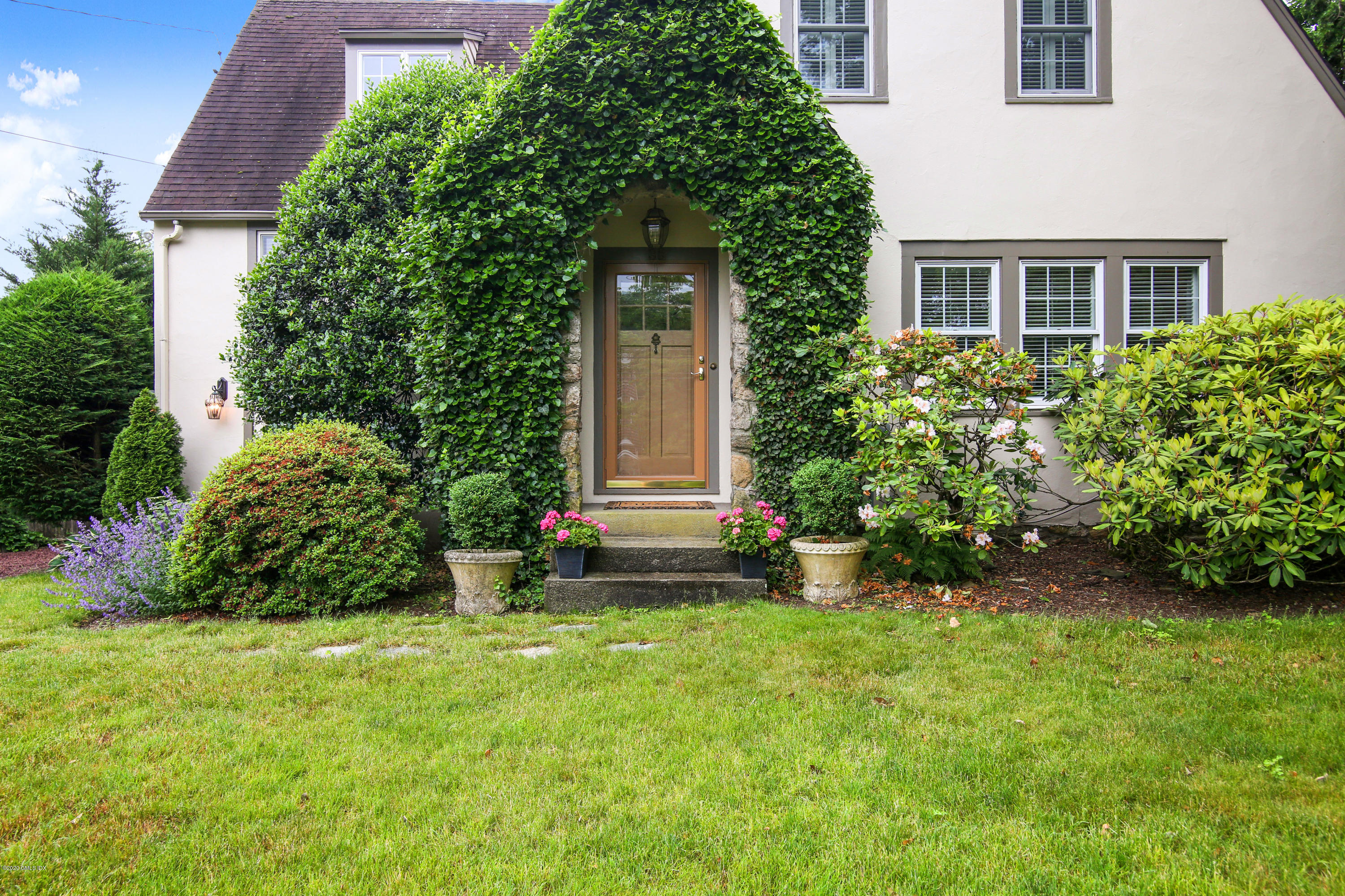 38 Oval Avenue Riverside, CT 06878 - Photo 27 of 33 front view of a house with a yard