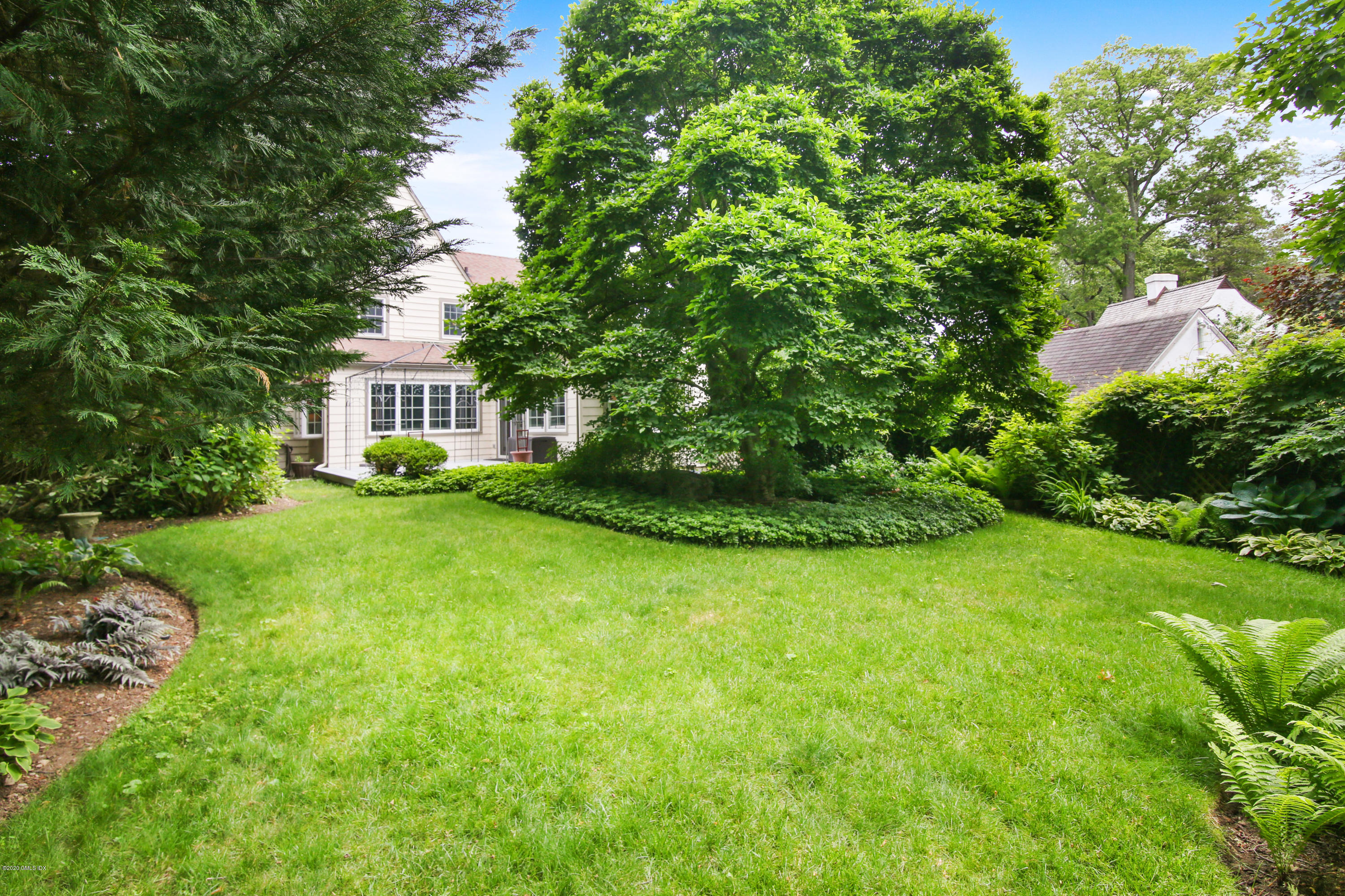 38 Oval Avenue Riverside, CT 06878 - Photo 29 of 33 a view of a house with a backyard