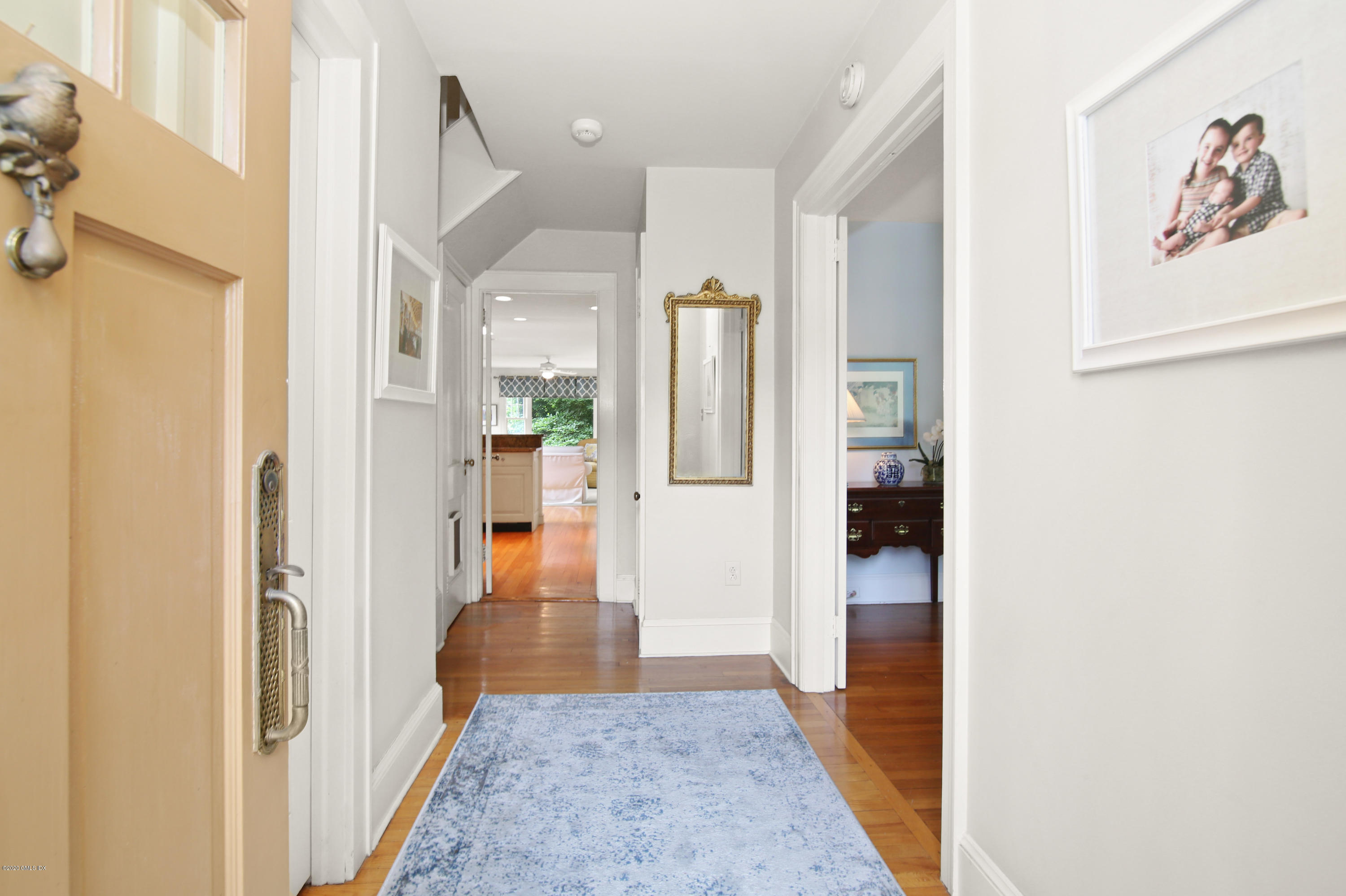 38 Oval Avenue Riverside, CT 06878 - Photo 4 of 33 a view of a hallway with wooden floor windows and kitchen view