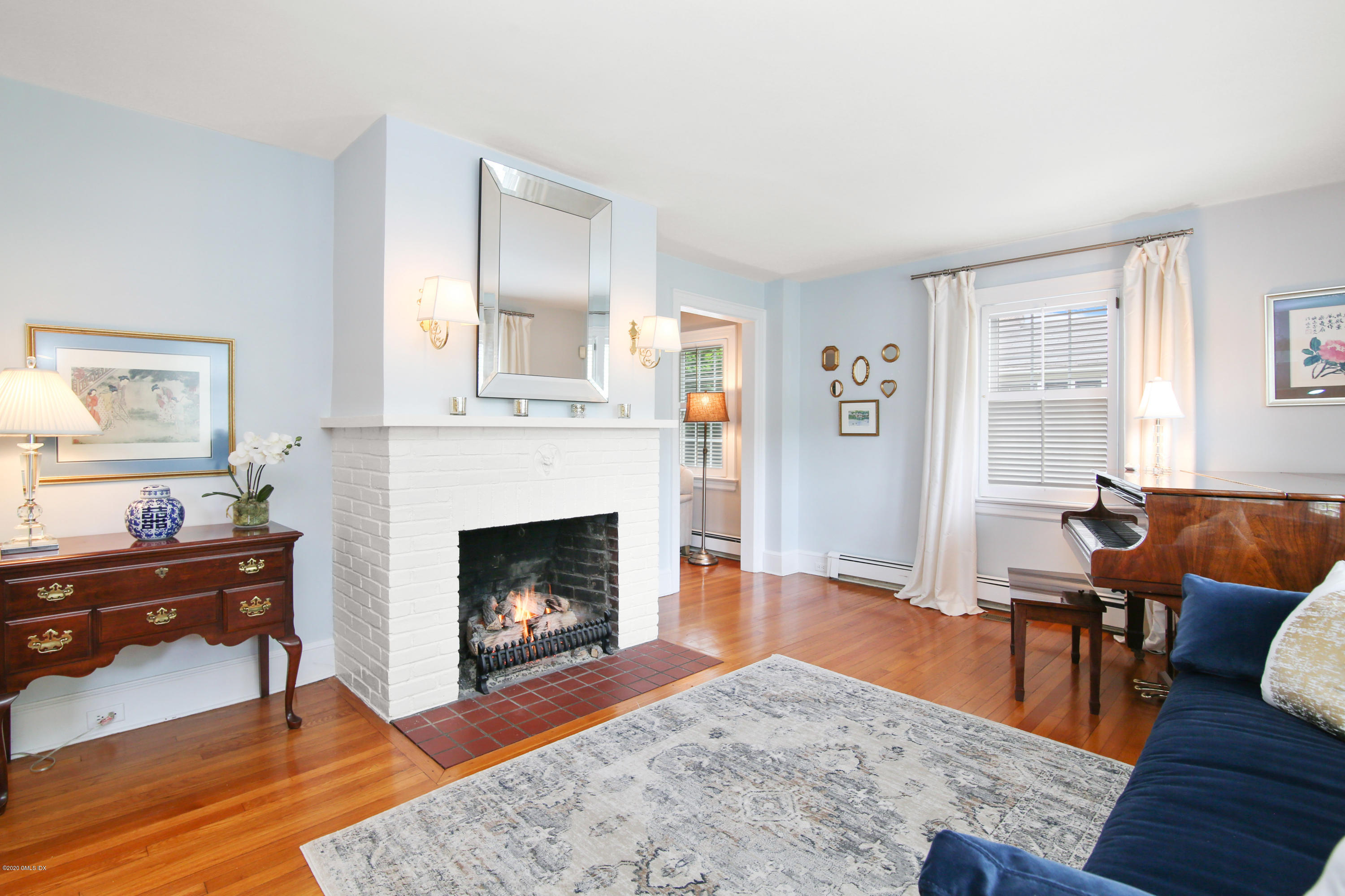 38 Oval Avenue Riverside, CT 06878 - Photo 6 of 33 a living room with furniture and a fireplace