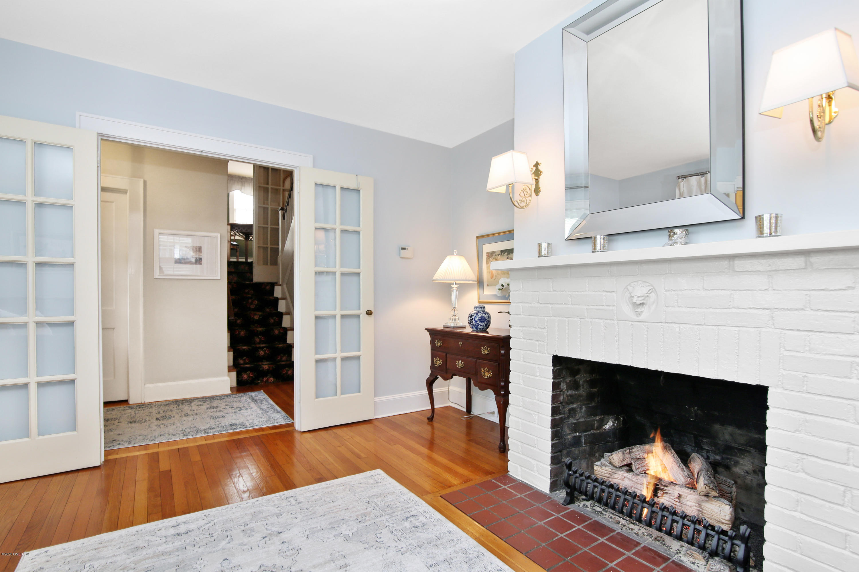 38 Oval Avenue Riverside, CT 06878 - Photo 7 of 33 a living room with furniture and a fireplace