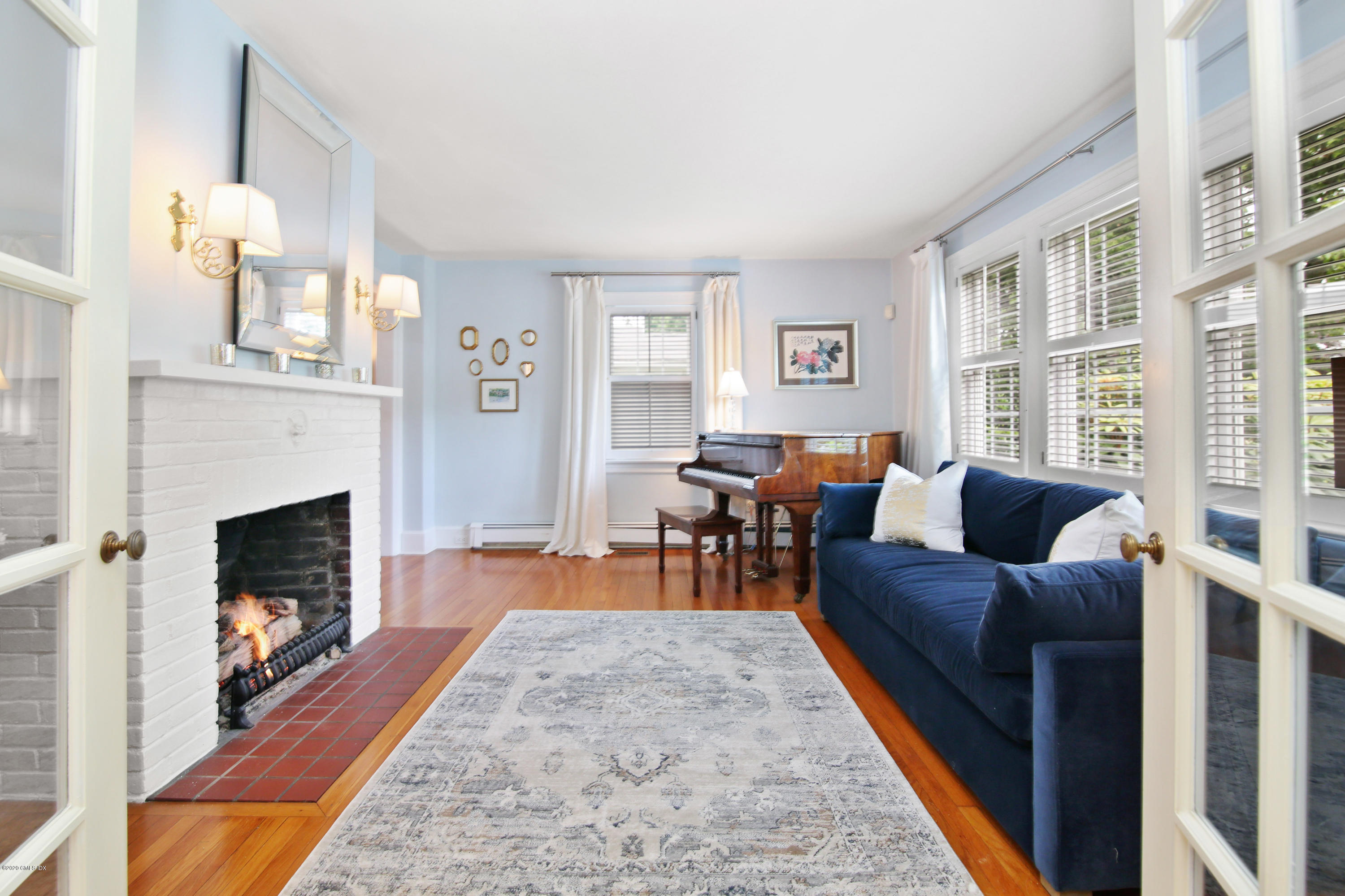 38 Oval Avenue Riverside, CT 06878 - Photo 8 of 33 a living room with furniture and a fireplace
